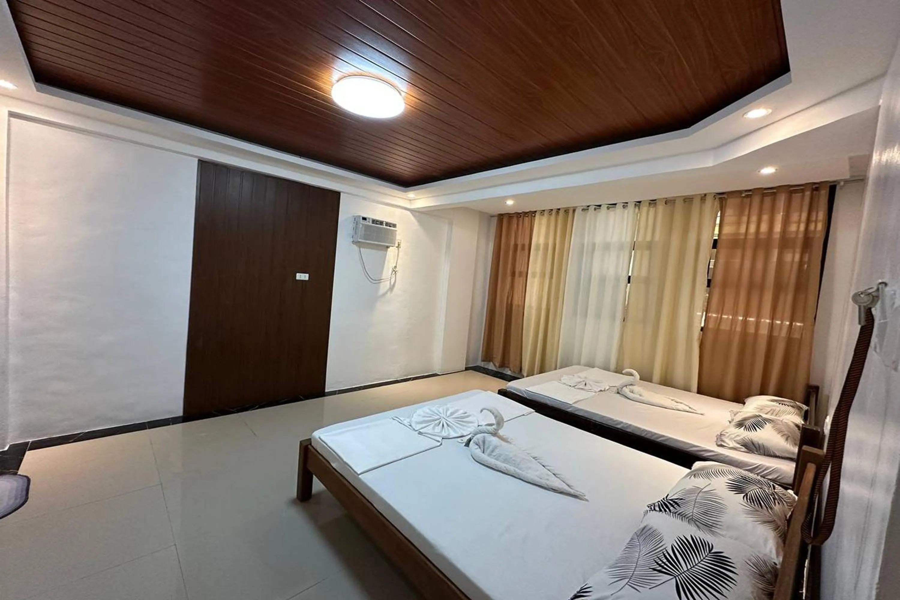 Bed in White-Beach Hideaway Resort Puerto Galera