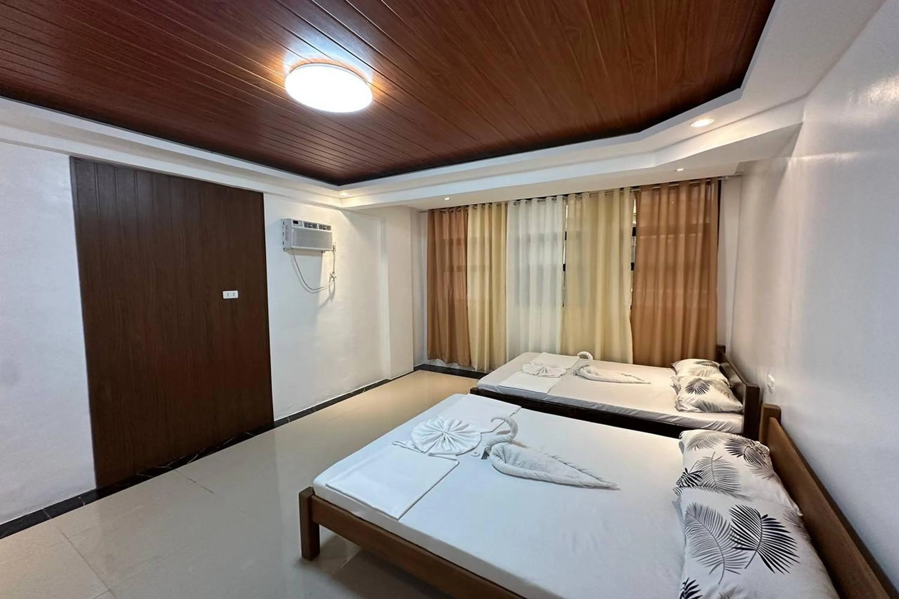 Bed in White-Beach Hideaway Resort Puerto Galera