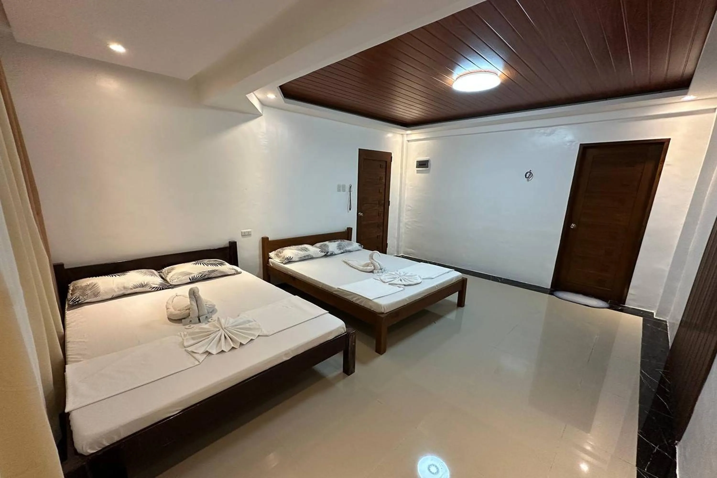 Bed in White-Beach Hideaway Resort Puerto Galera