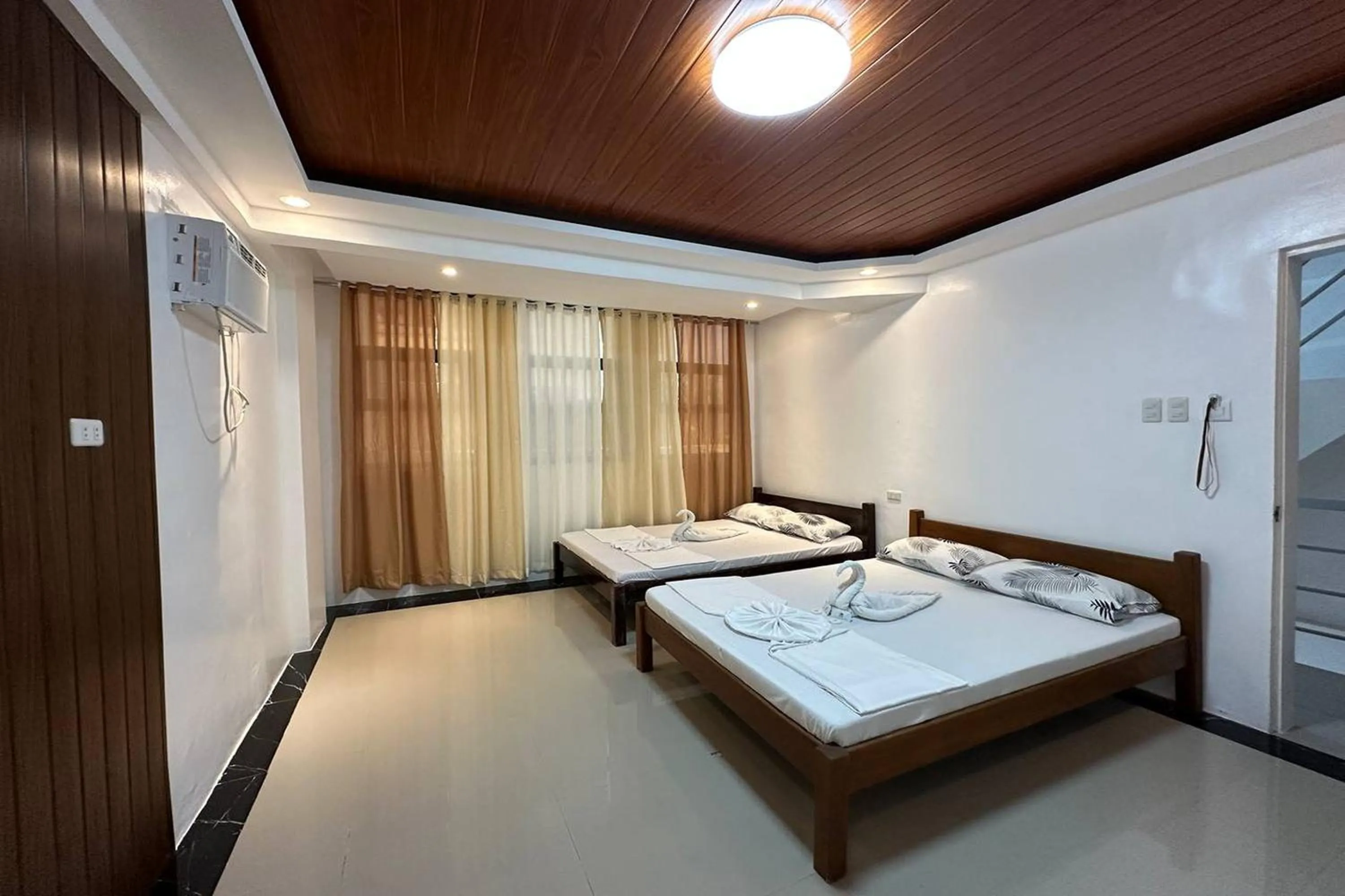 Bed in White-Beach Hideaway Resort Puerto Galera