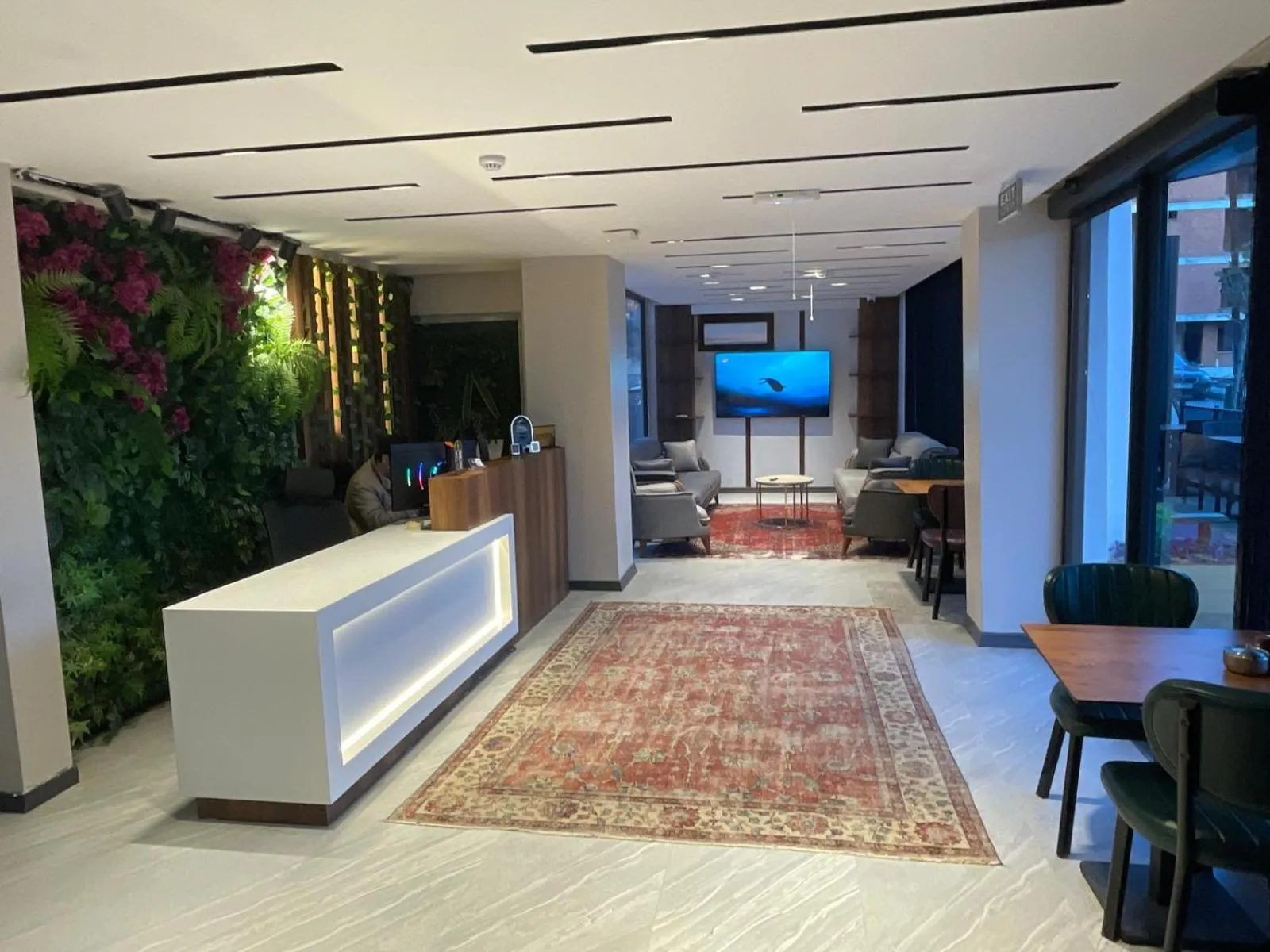 Communal lounge/ TV room in HillTown Airport Hotel & Restaurant