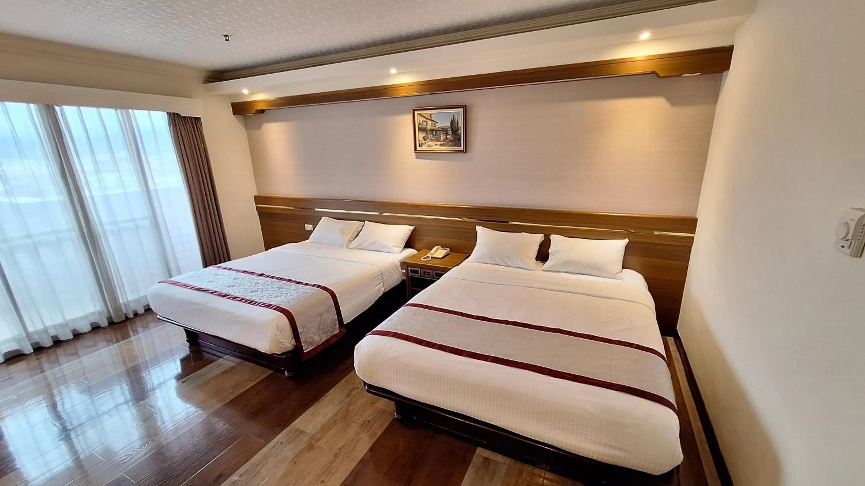 Bed in Cheng Pao Hotel