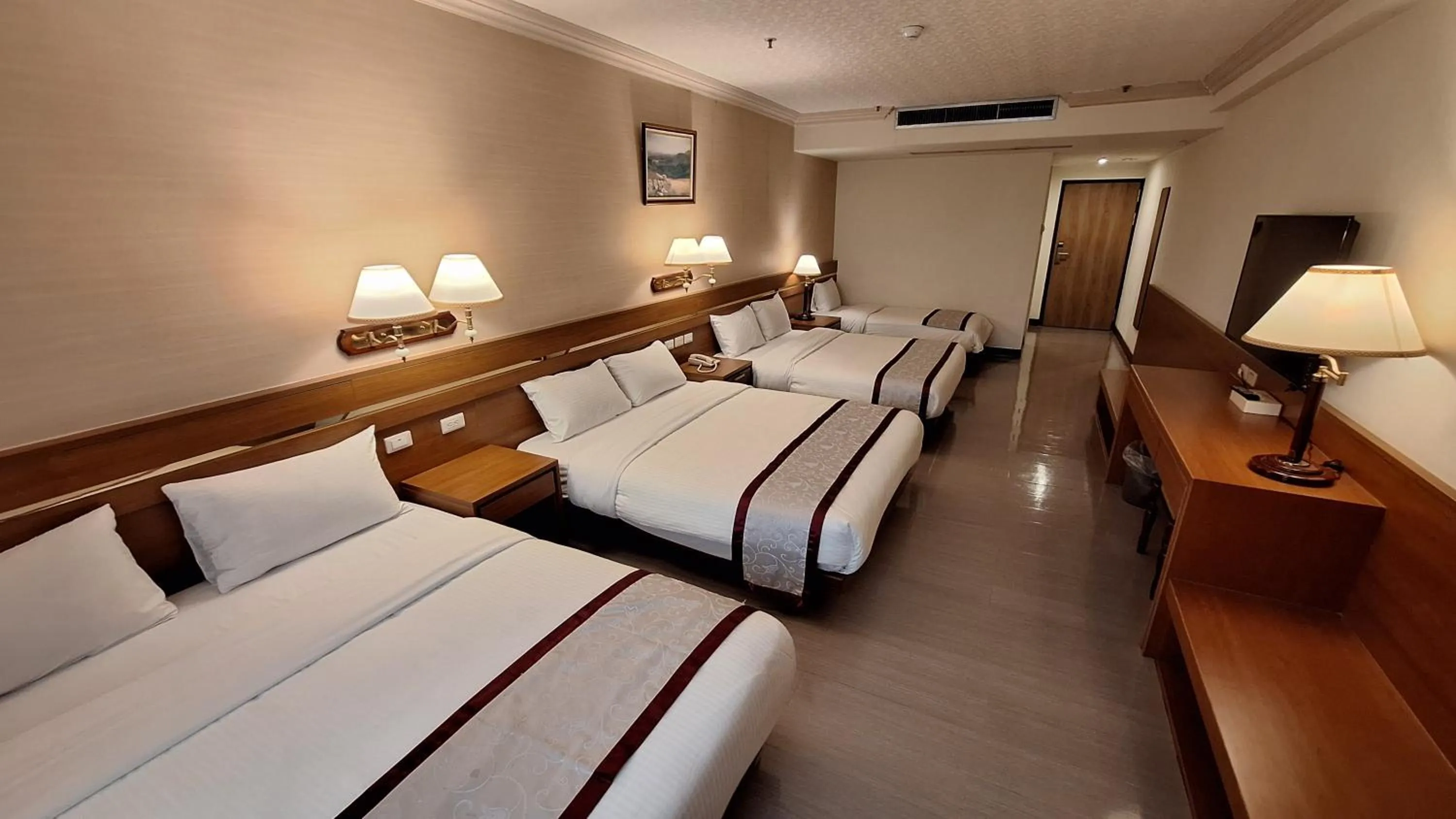 Bed in Cheng Pao Hotel