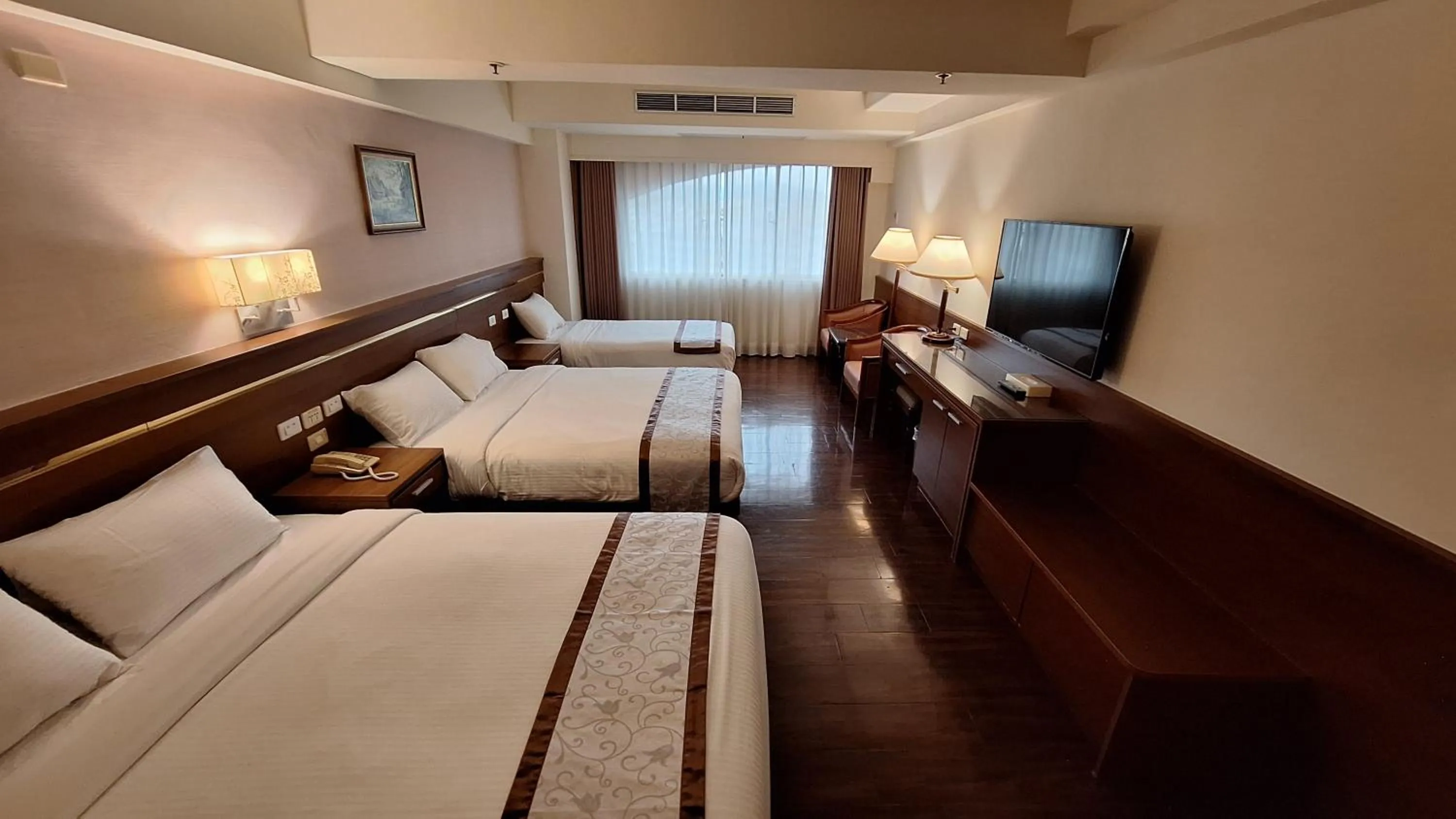 Bed in Cheng Pao Hotel