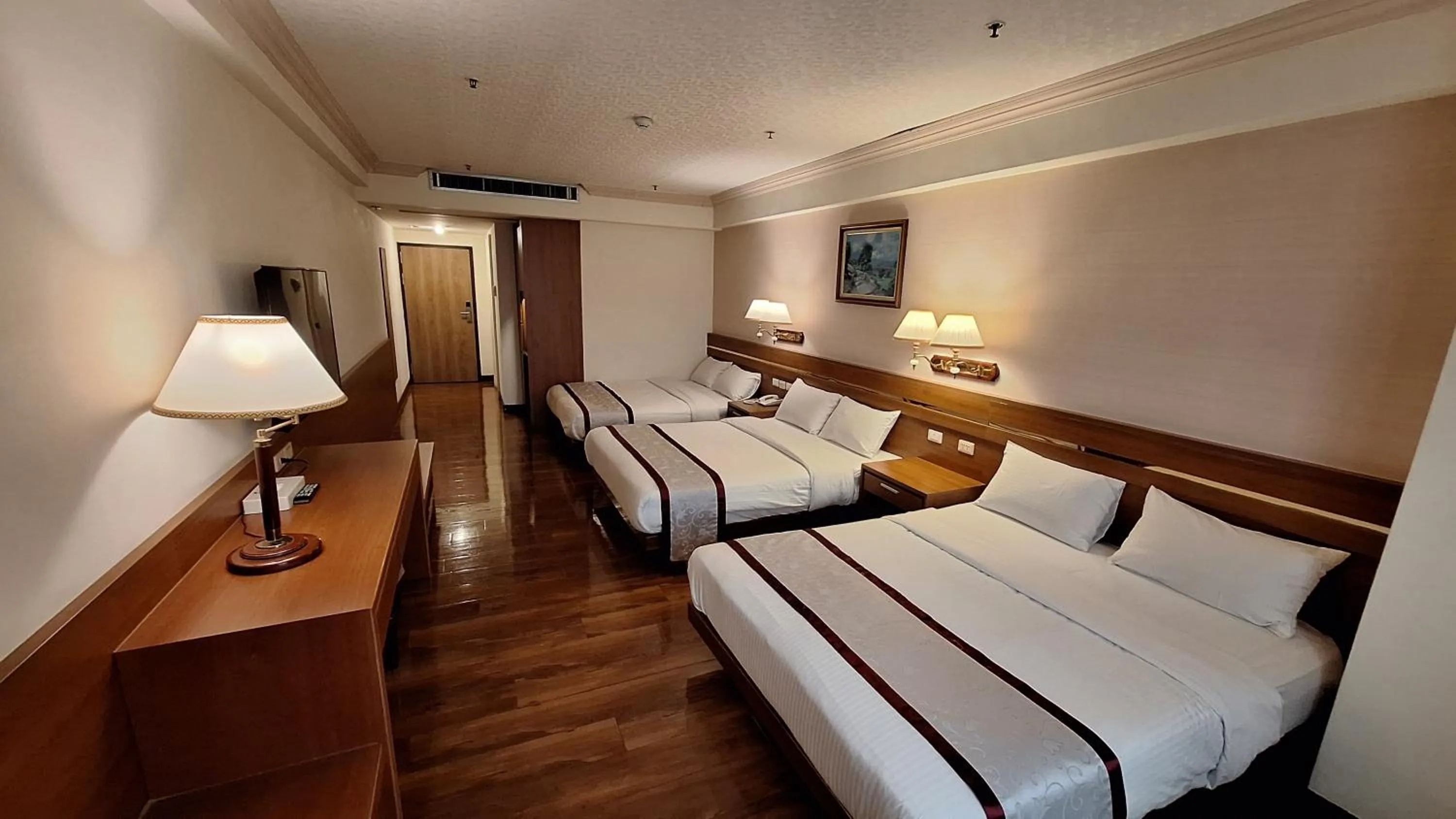 Bed in Cheng Pao Hotel