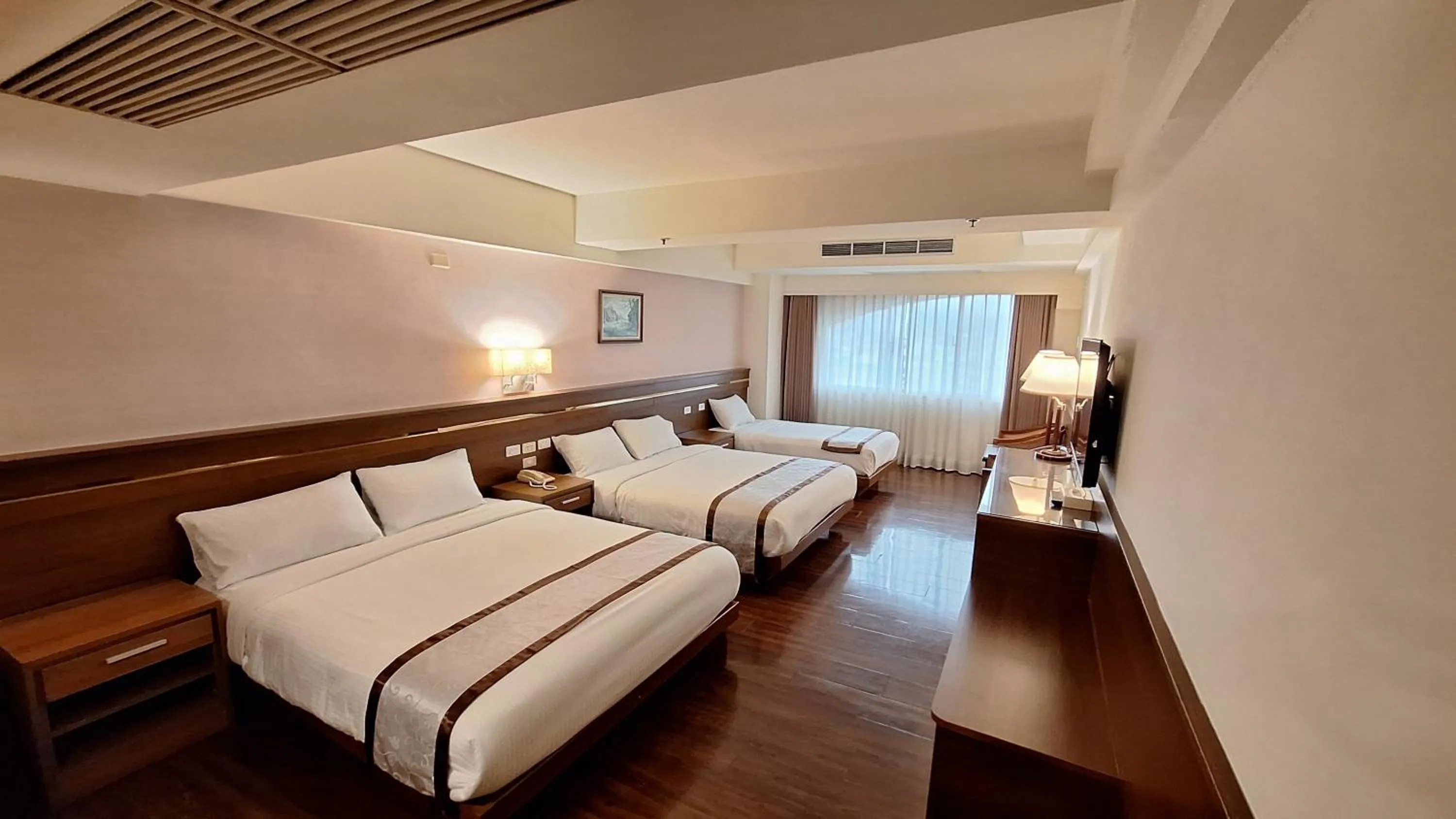Bed in Cheng Pao Hotel