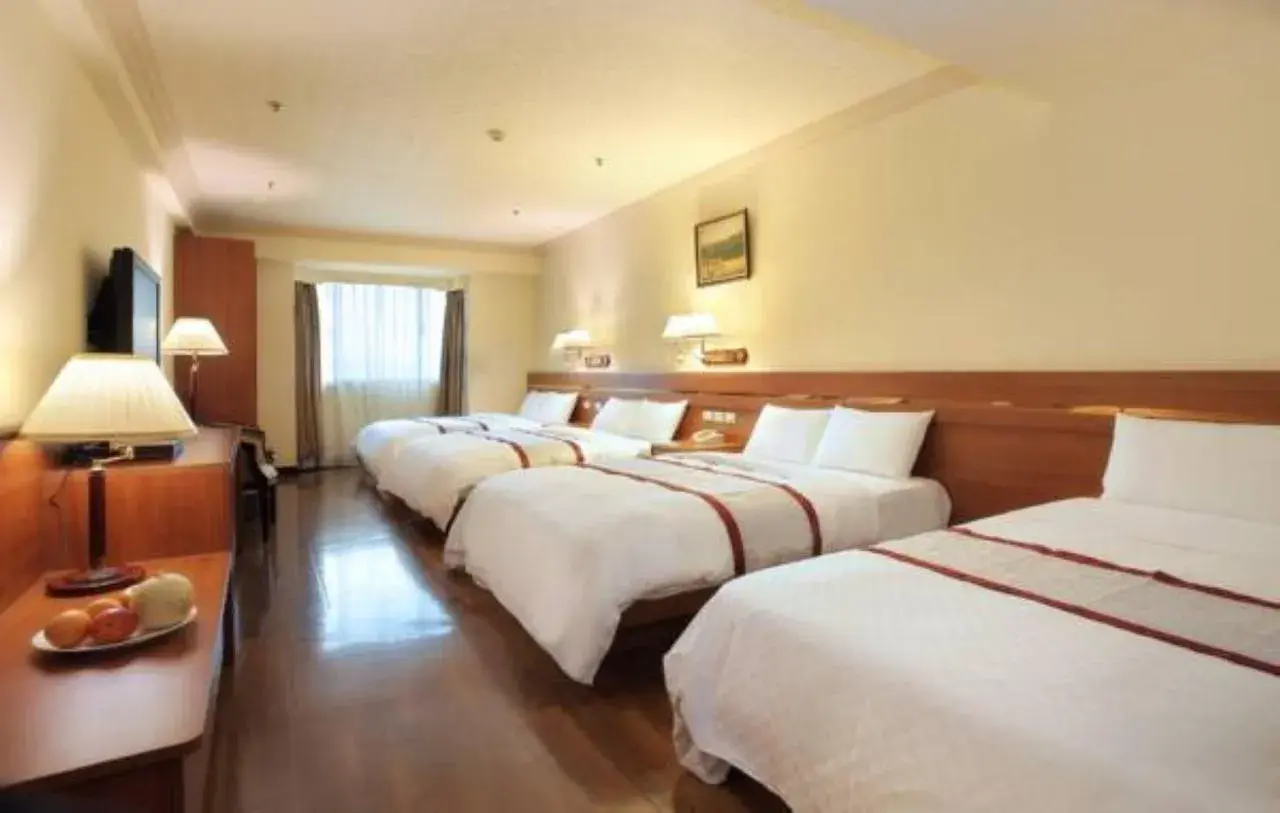 Bed in Cheng Pao Hotel Bed in Cheng Pao Hotel