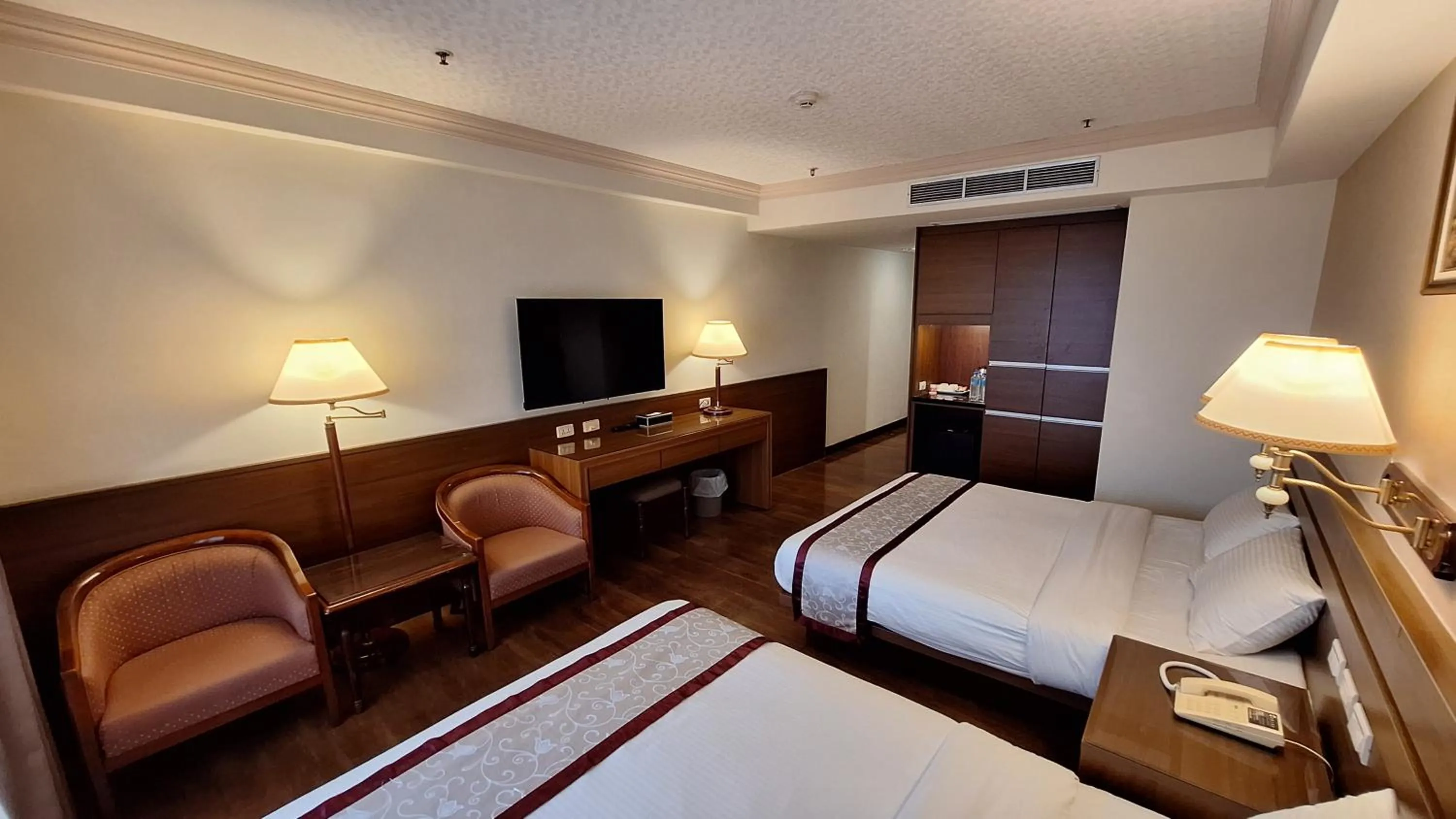 Bed in Cheng Pao Hotel