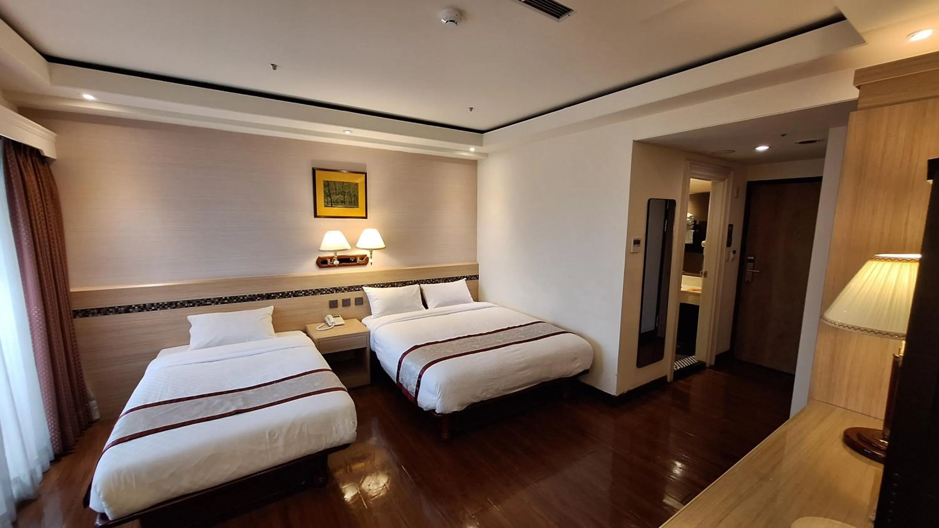 Bed in Cheng Pao Hotel