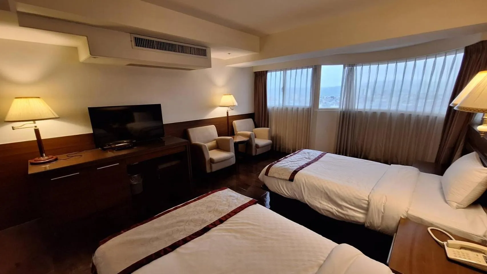 Bed in Cheng Pao Hotel