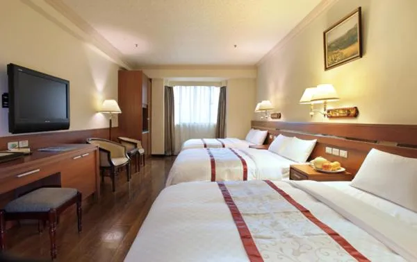 Bed in Cheng Pao Hotel