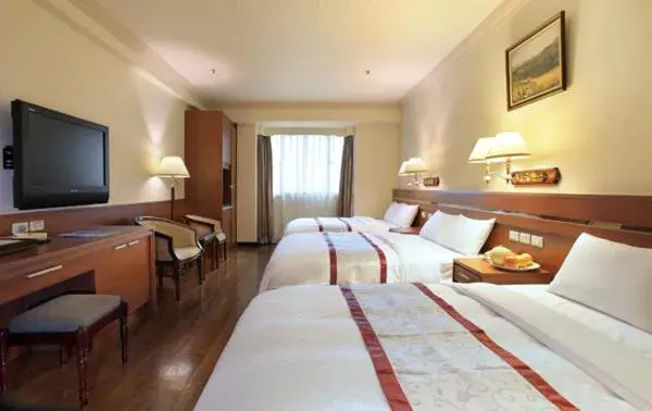 Bed in Cheng Pao Hotel Bed in Cheng Pao Hotel