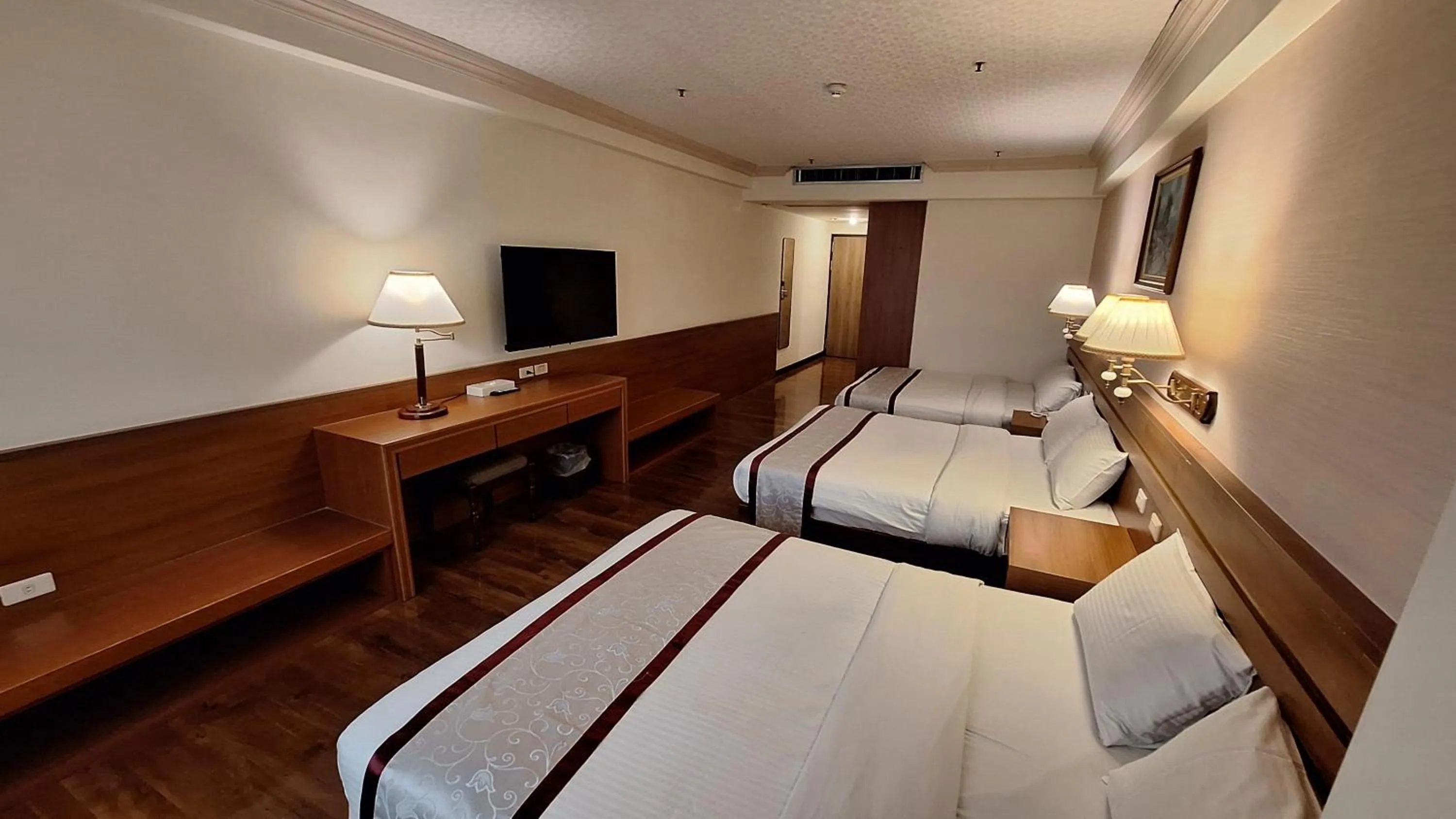 Bed in Cheng Pao Hotel