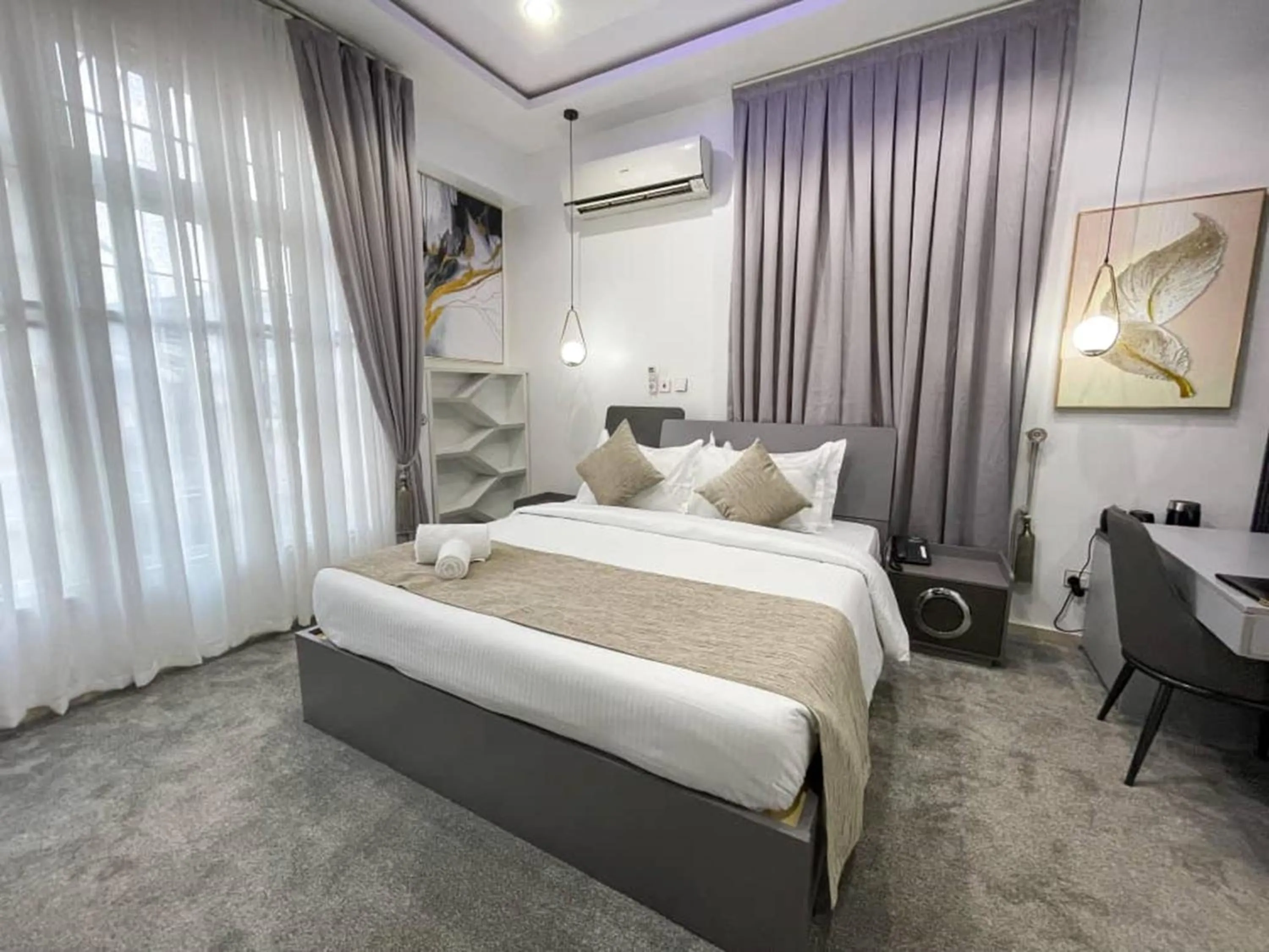 Bed in UrbanEdge Hotel