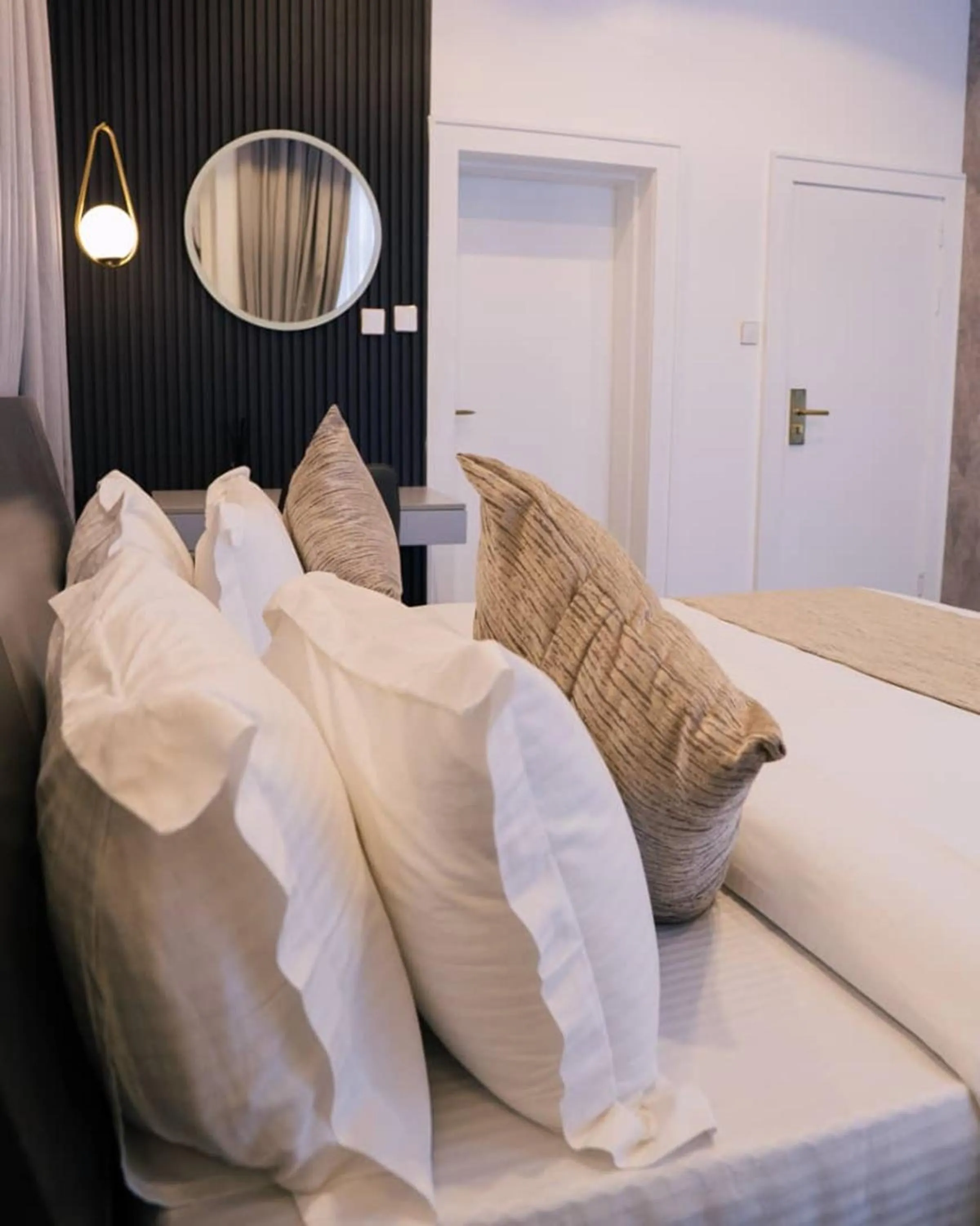 Bed in UrbanEdge Hotel