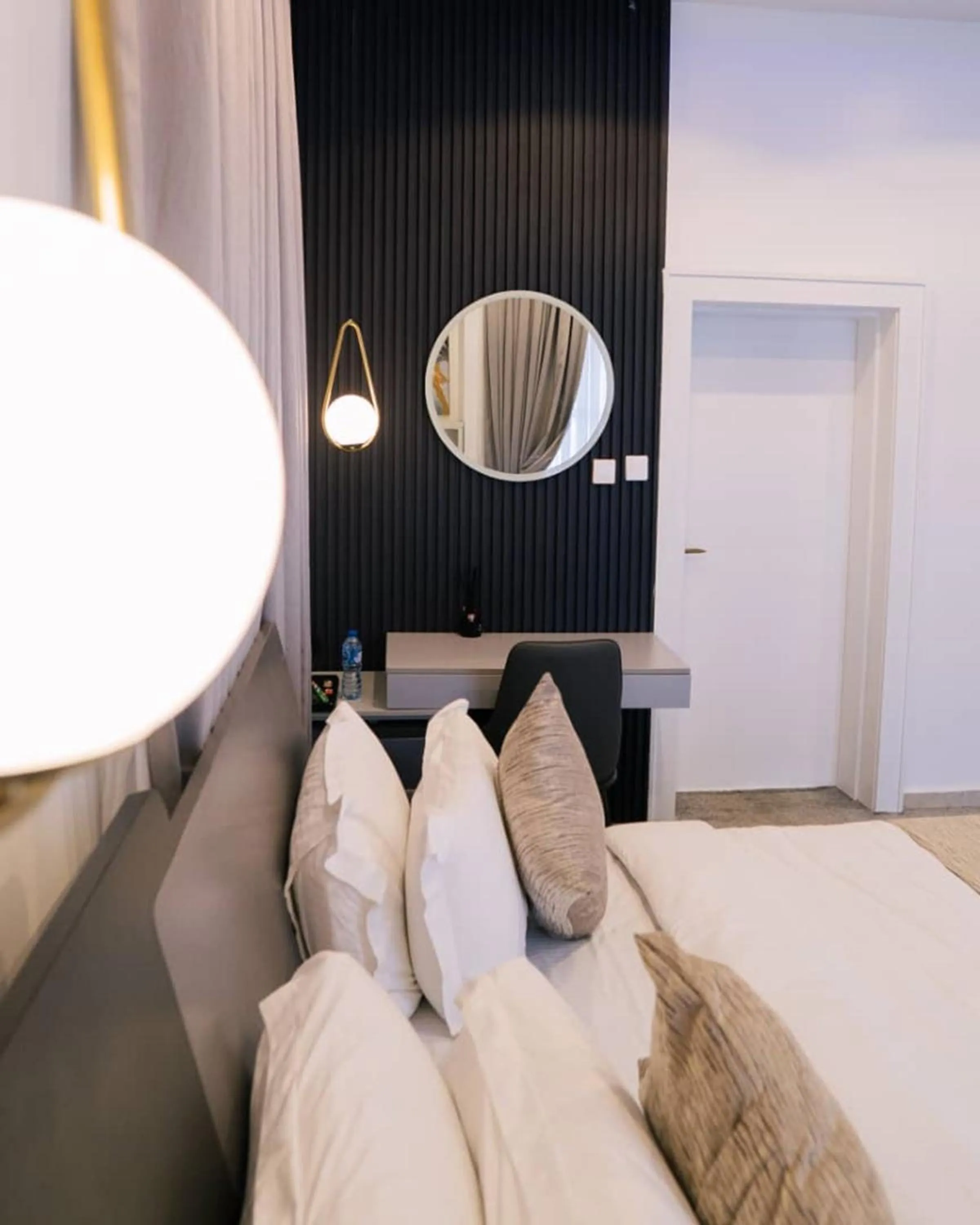 Bed in UrbanEdge Hotel