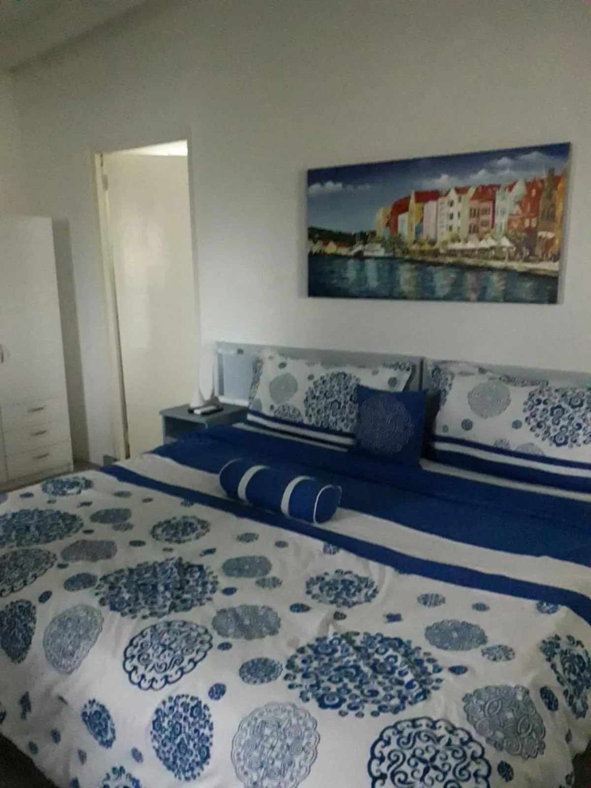 Bed in Palm Trees Apartments