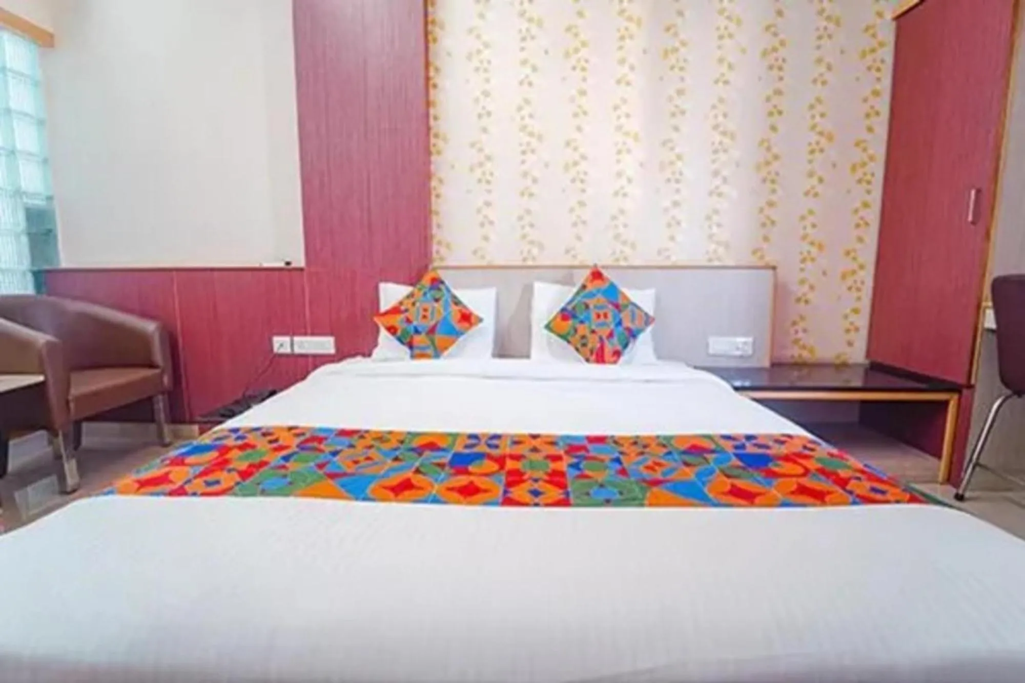 Bed in FabHotel Grand Gunas