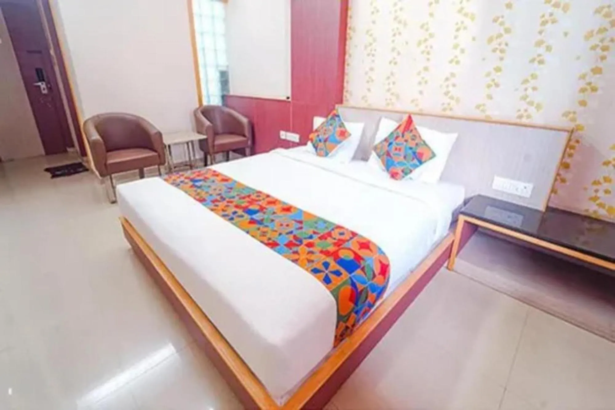 Bed in FabHotel Grand Gunas