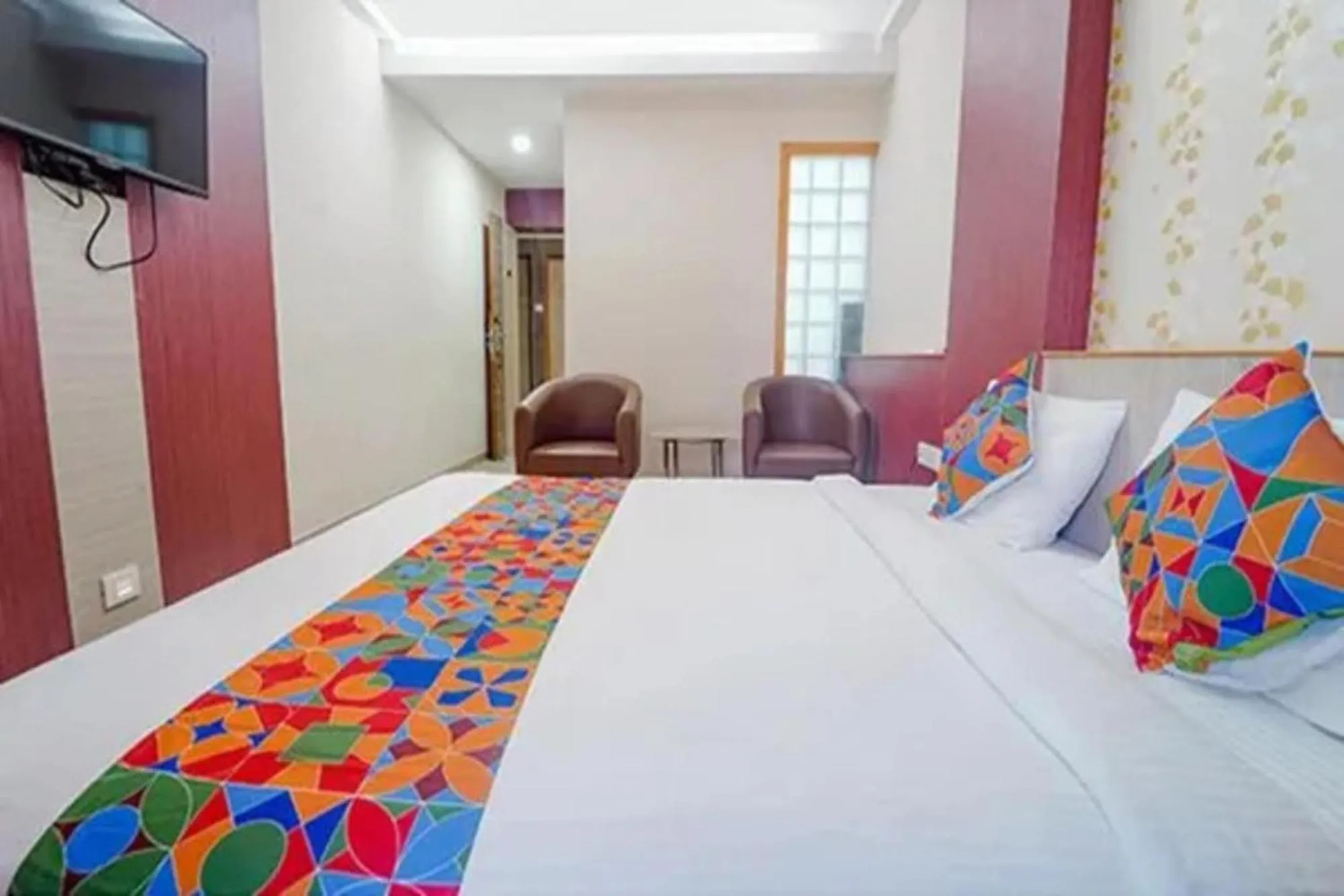 Bed in FabHotel Grand Gunas