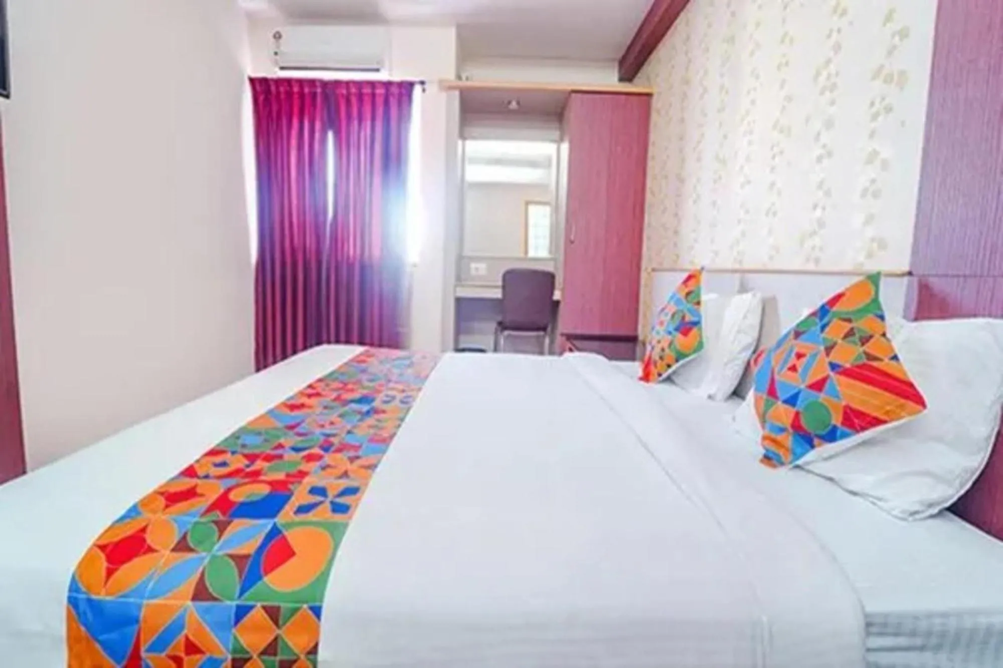 Bed in FabHotel Grand Gunas