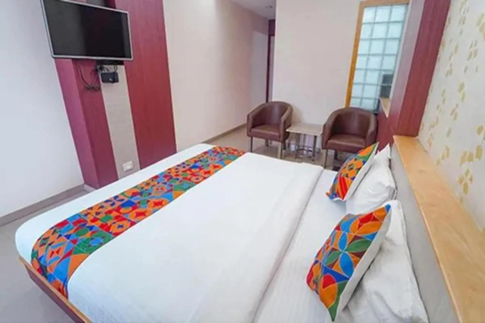 Bed in FabHotel Grand Gunas