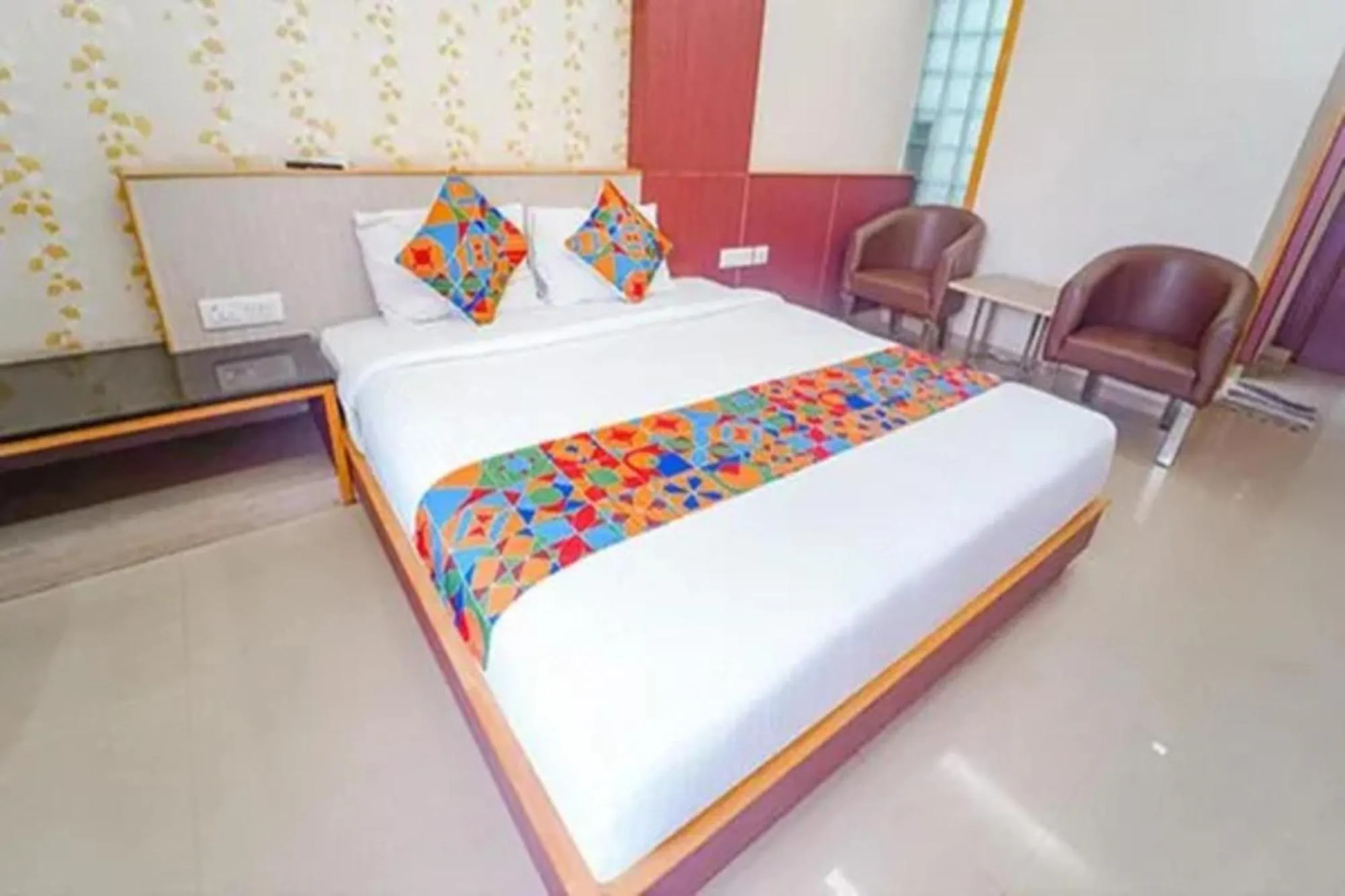 Bed in FabHotel Grand Gunas