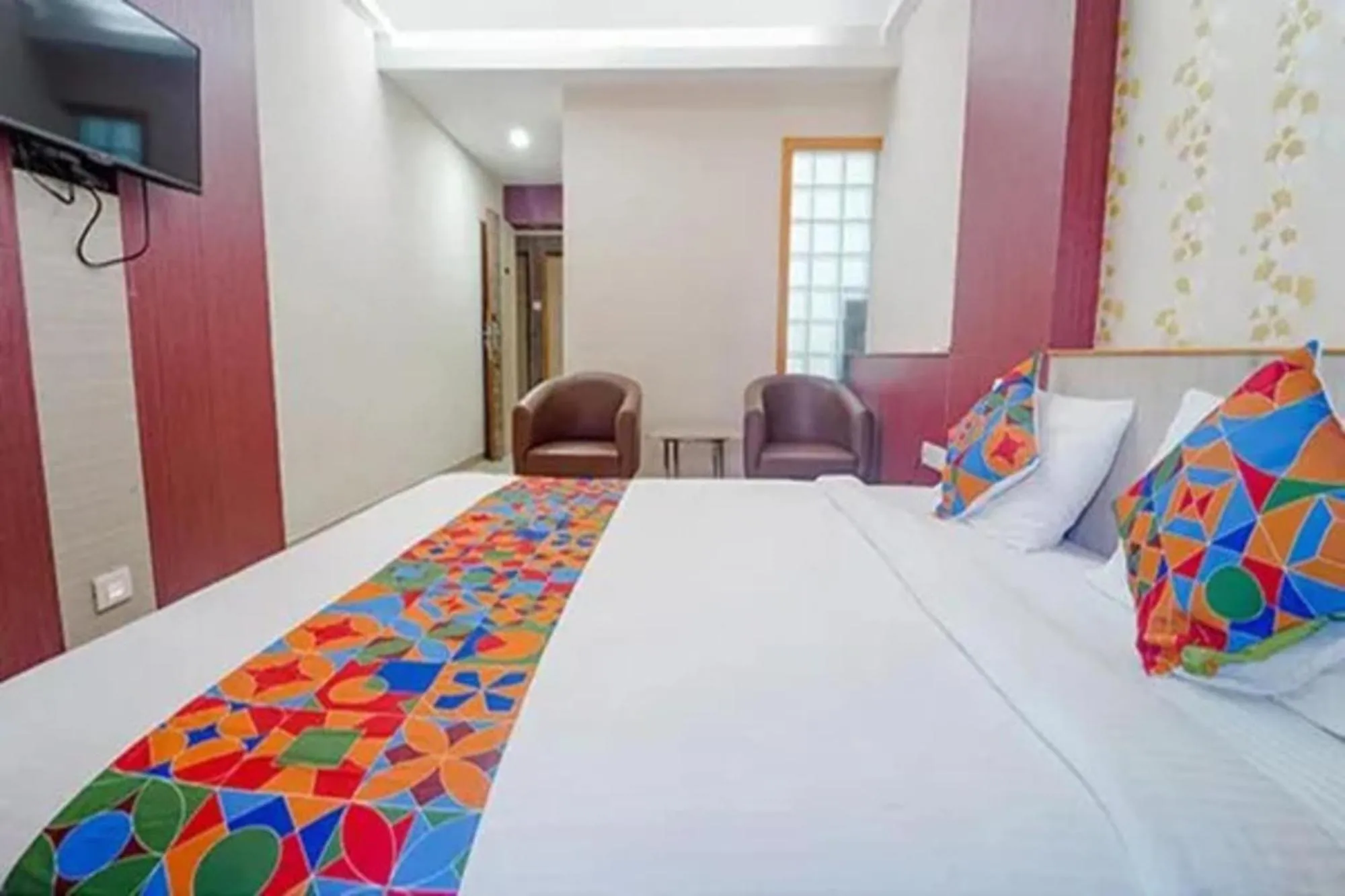 Bed in FabHotel Grand Gunas
