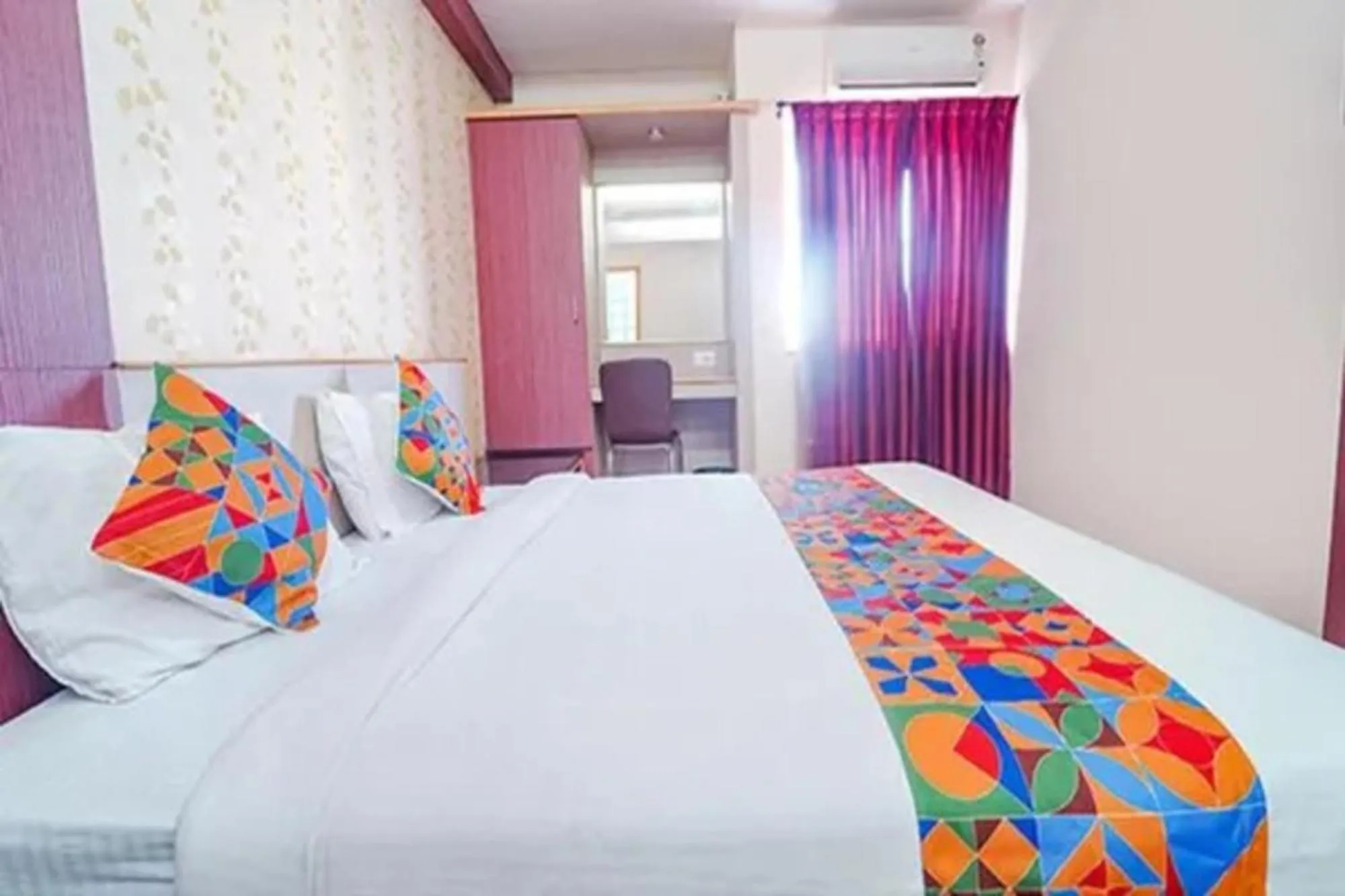 Bed in FabHotel Grand Gunas