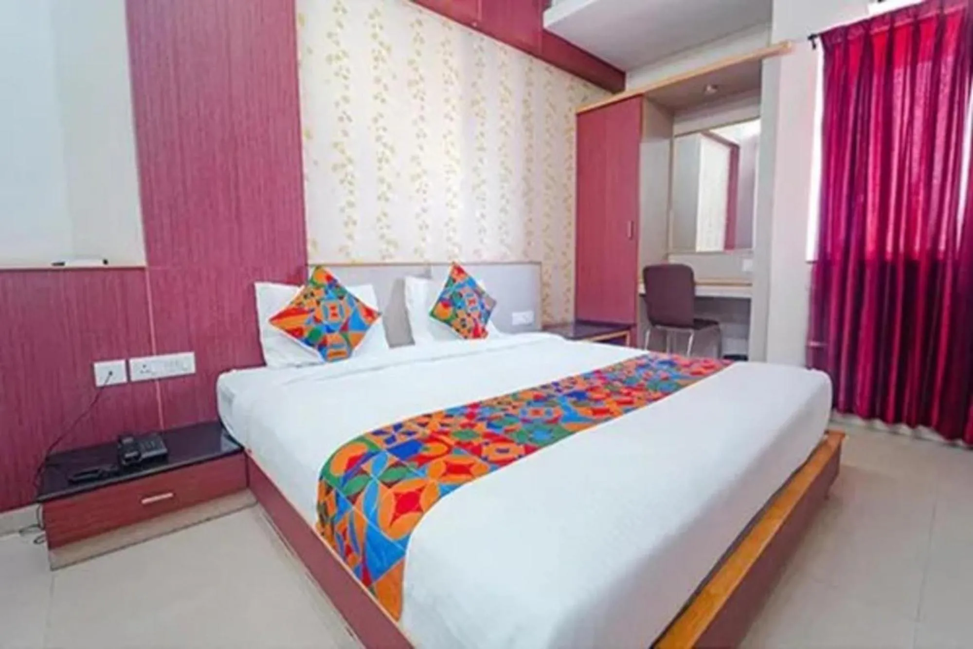 Bed in FabHotel Grand Gunas