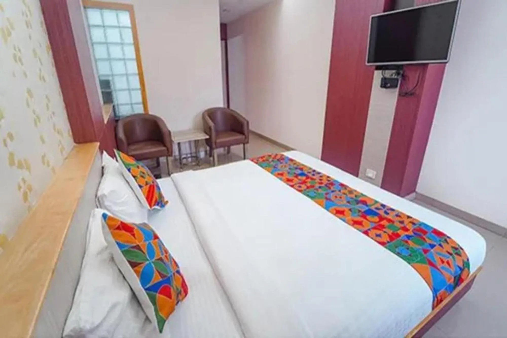 Bed in FabHotel Grand Gunas