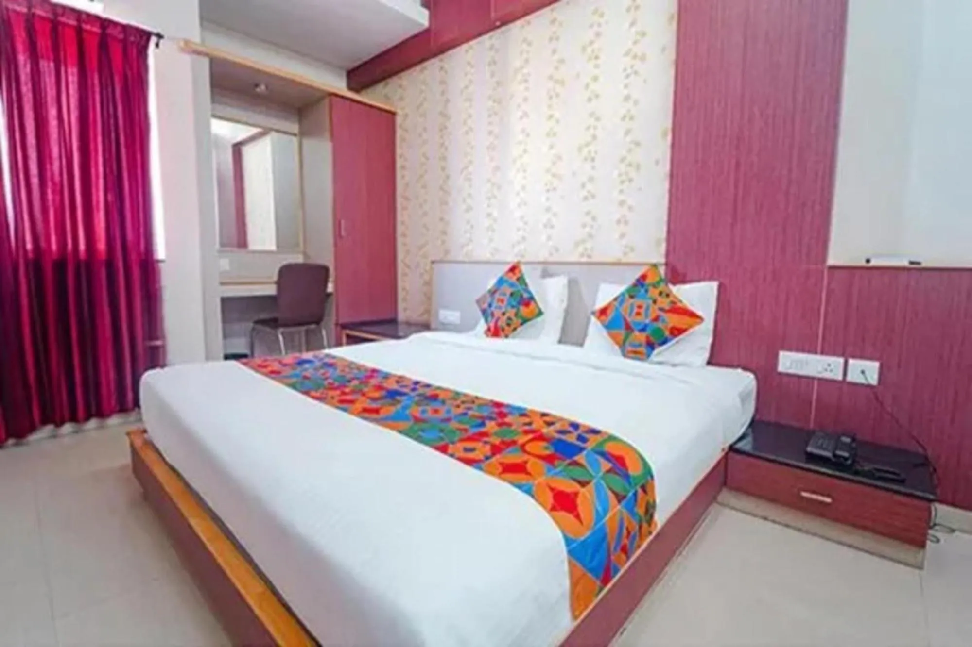 Bed in FabHotel Grand Gunas