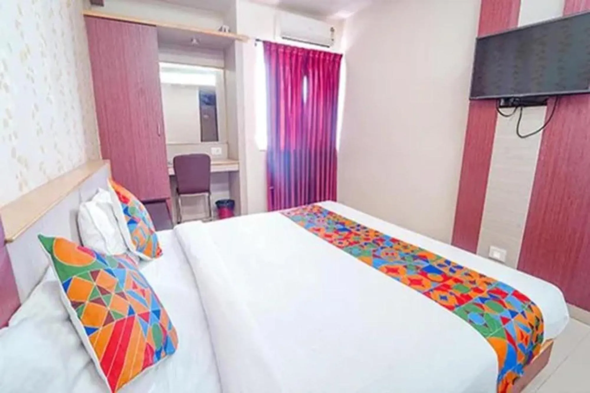 Bed in FabHotel Grand Gunas