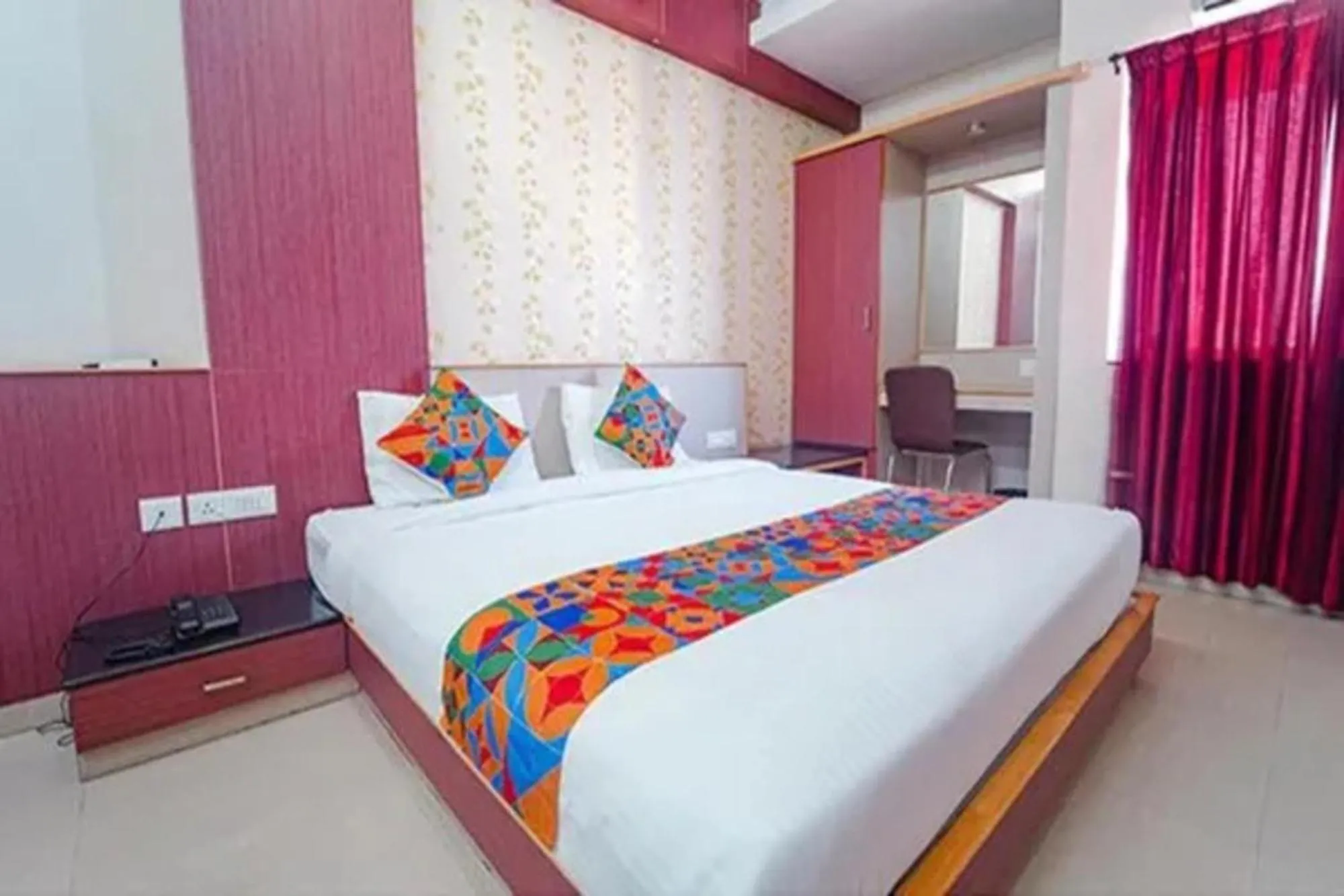 Bed in FabHotel Grand Gunas