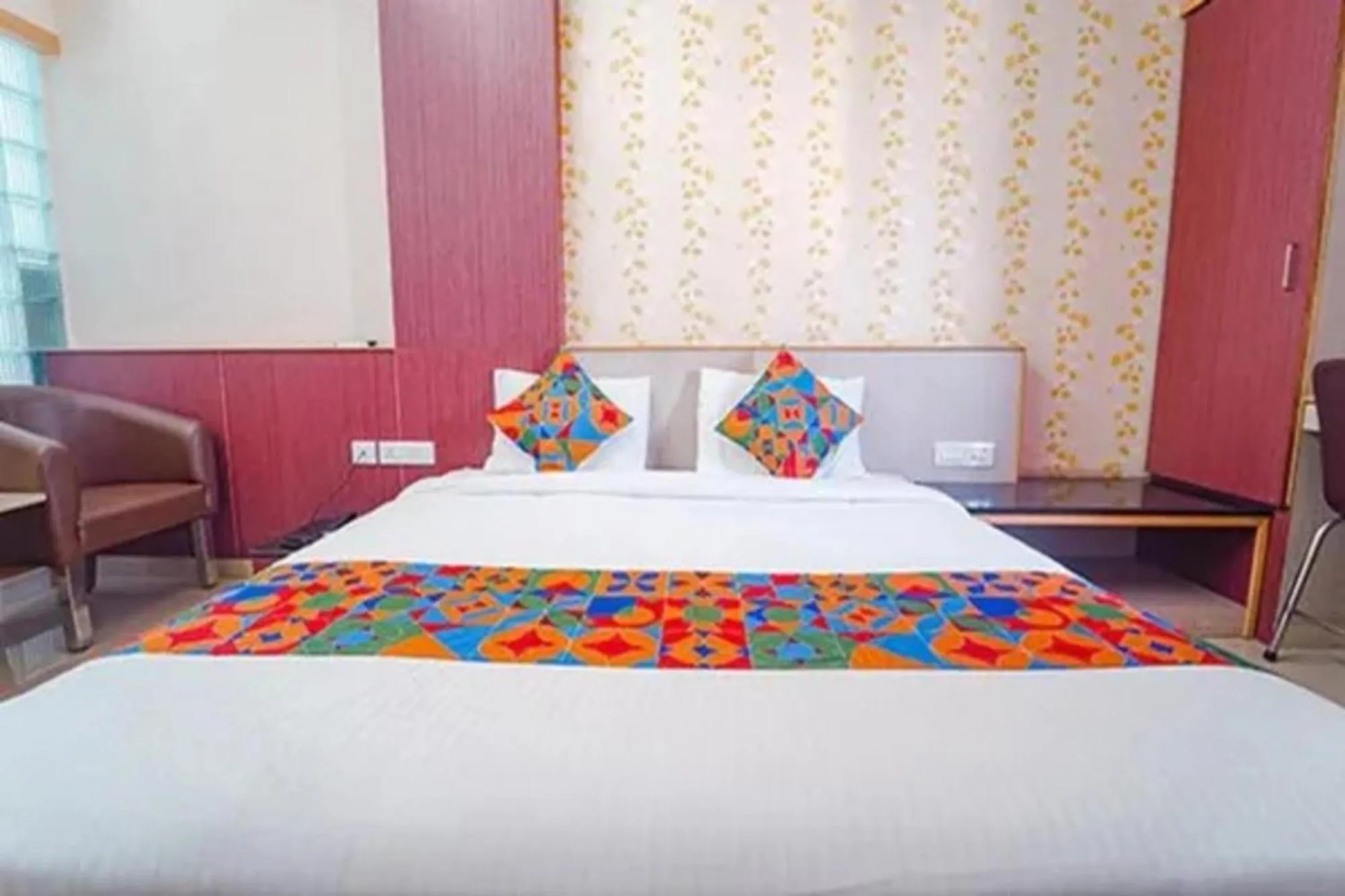 Bed in FabHotel Grand Gunas