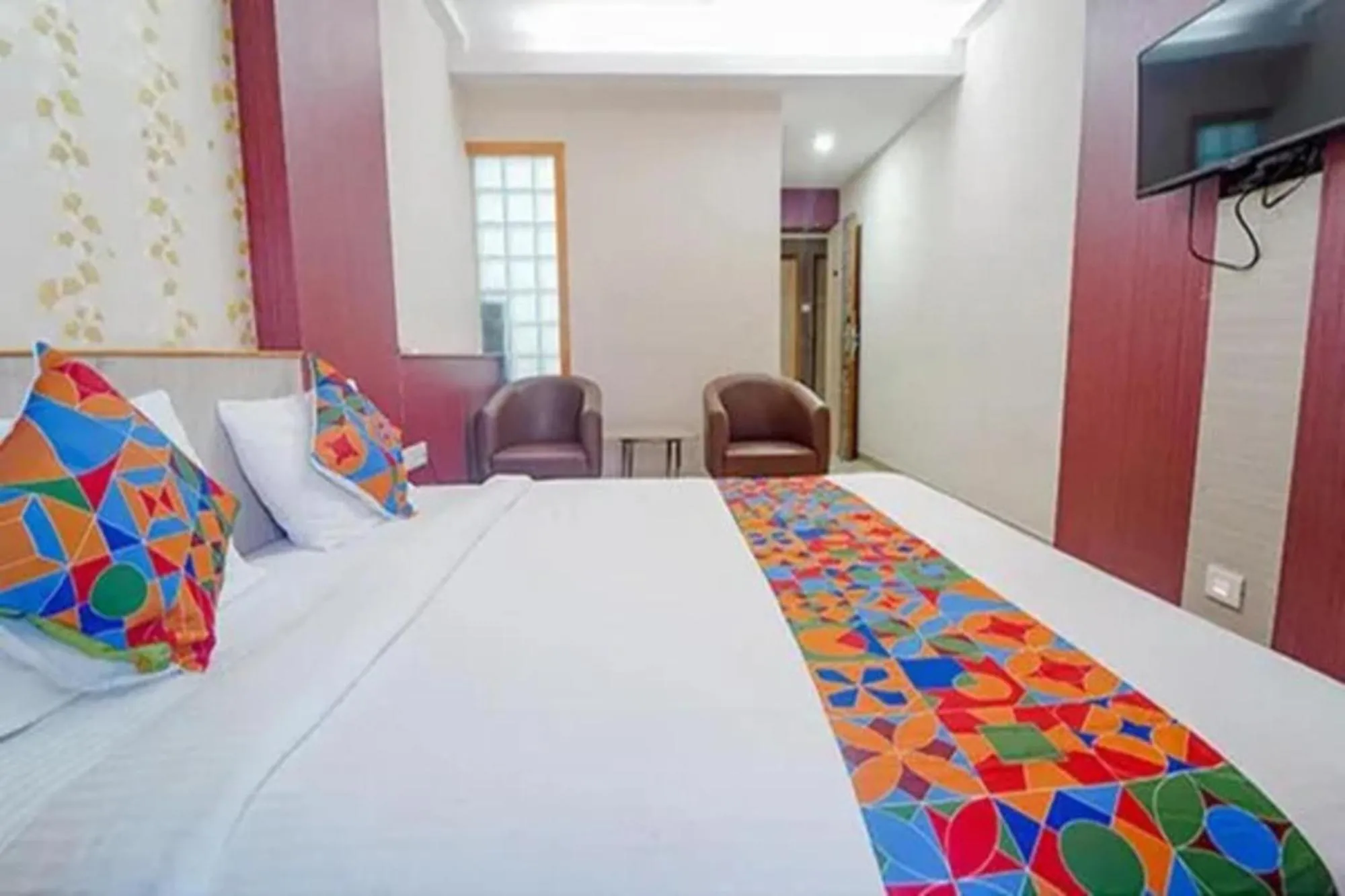 Bed in FabHotel Grand Gunas