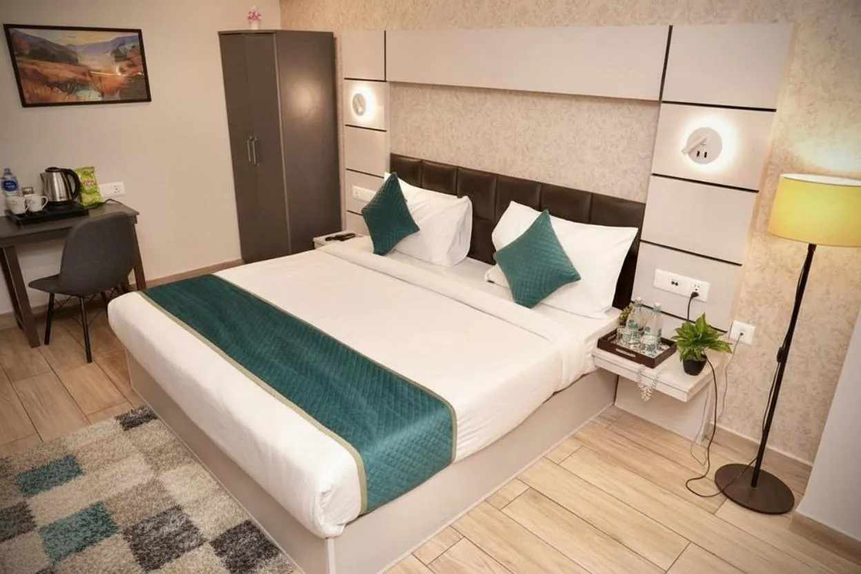 Bed in Hotel Royal Saffron by Majesta Stays