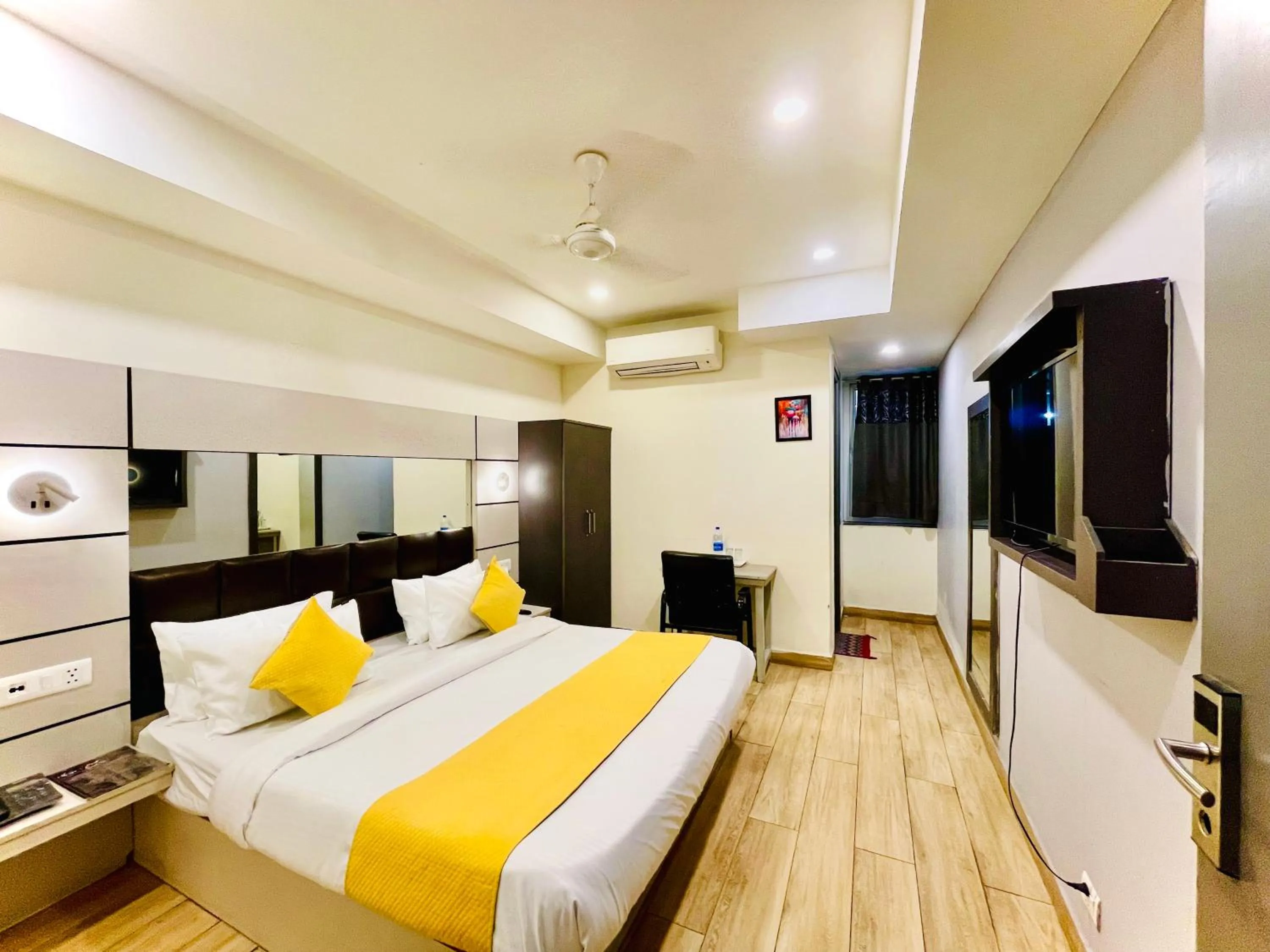 Bed in Hotel Royal Saffron by Majesta Stays