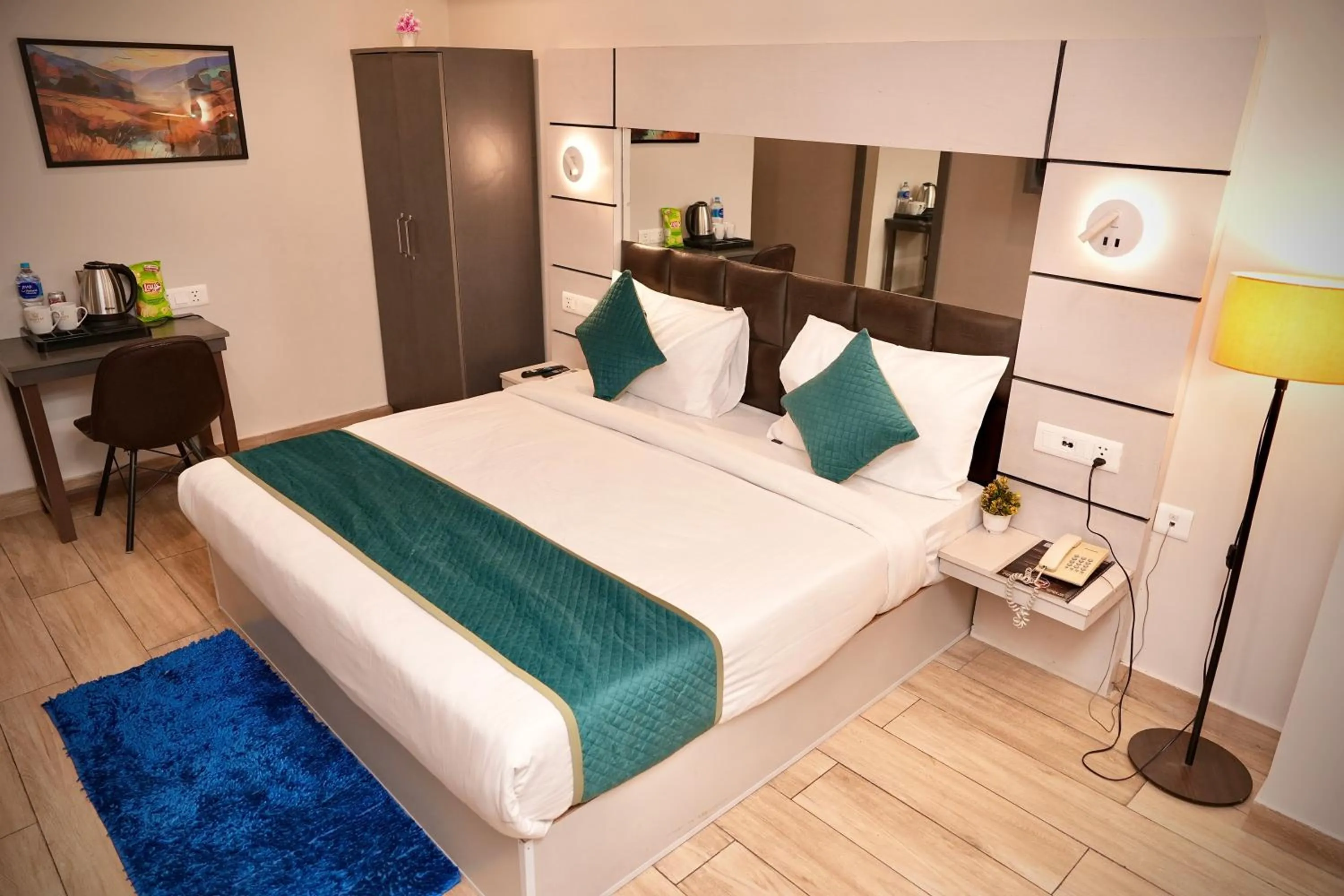 Bed in Hotel Royal Saffron by Majesta Stays