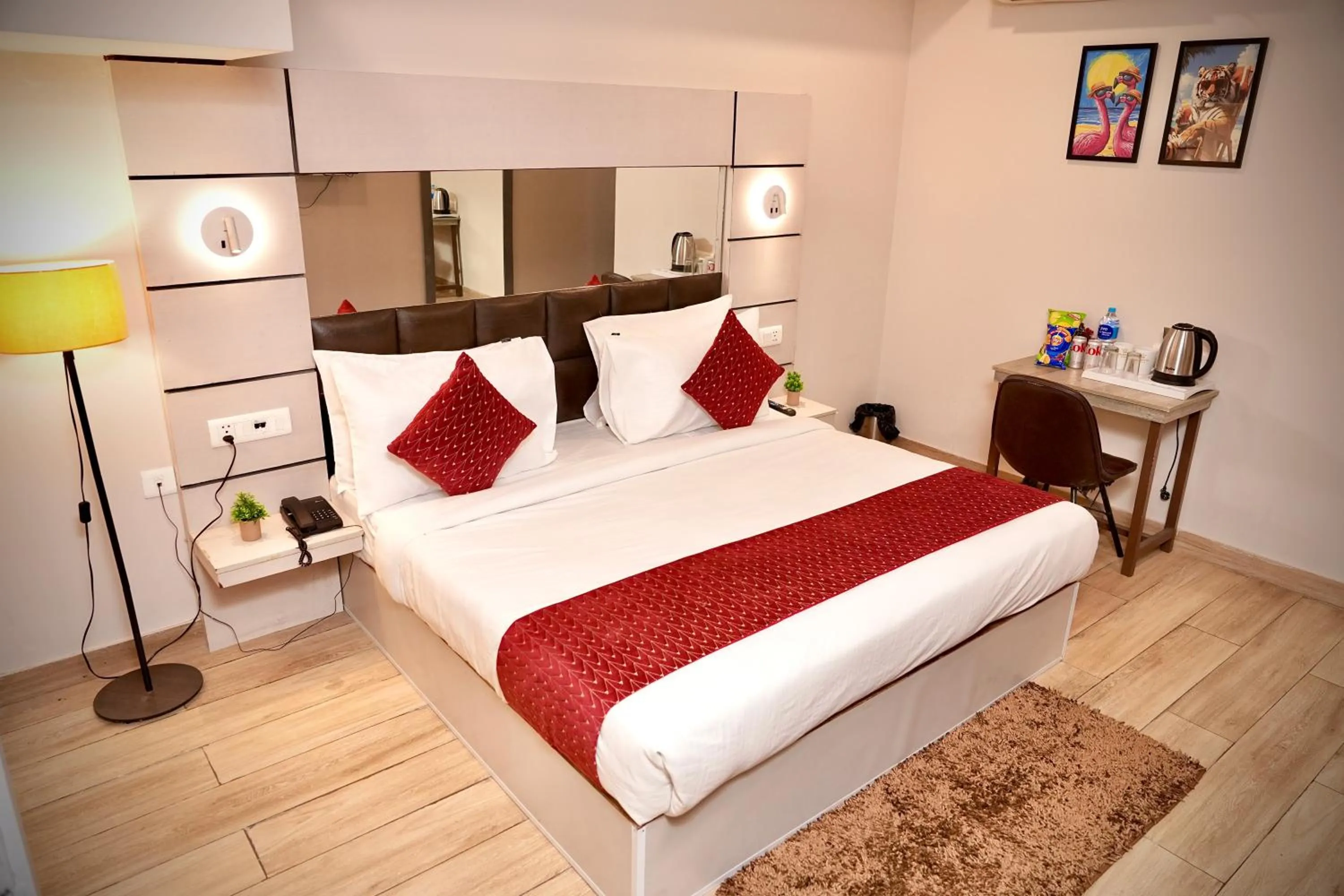 Bed in Hotel Royal Saffron by Majesta Stays