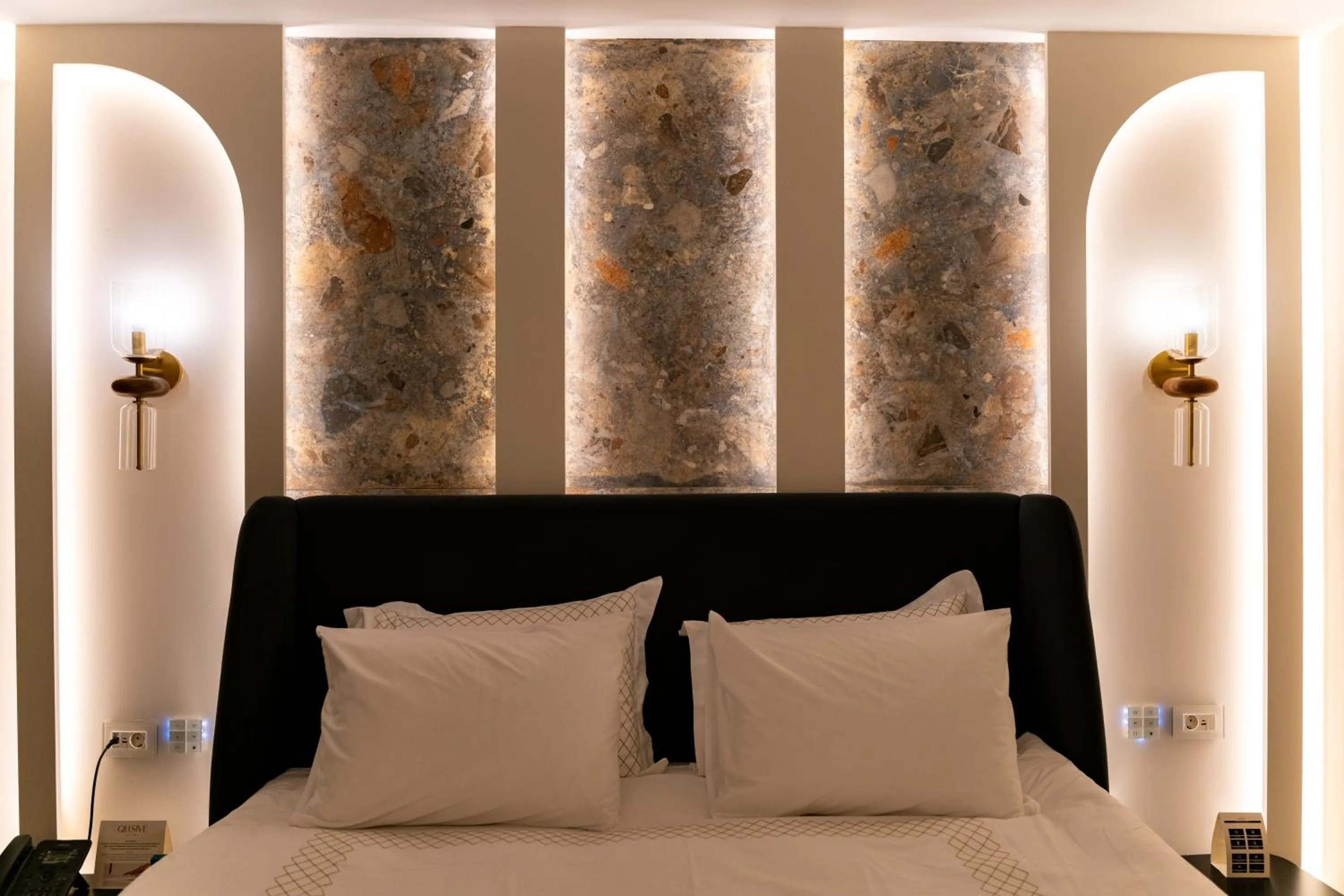 Bed in Qlusive Hotel