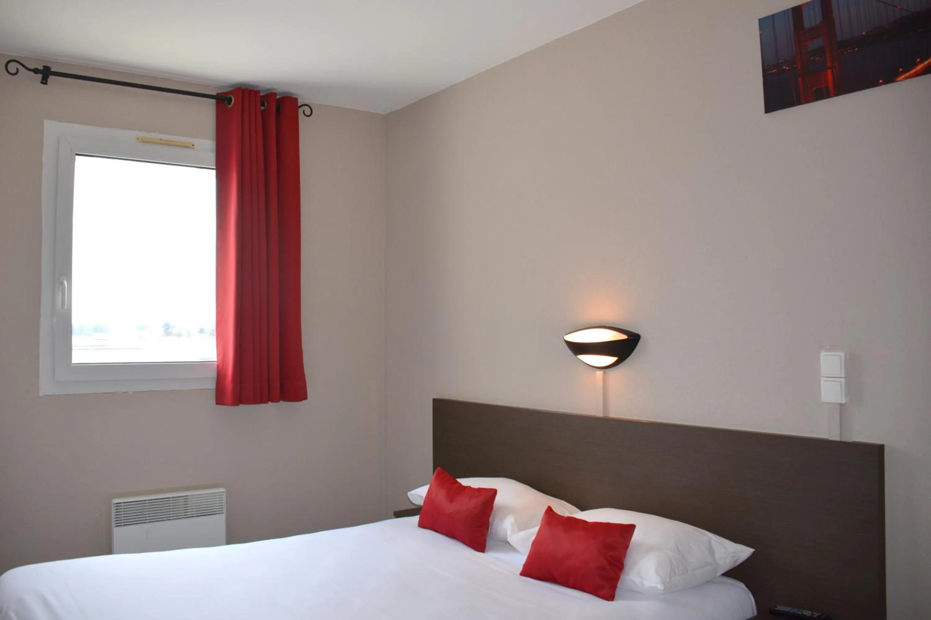 Bedroom in Hôtel Le Floreal