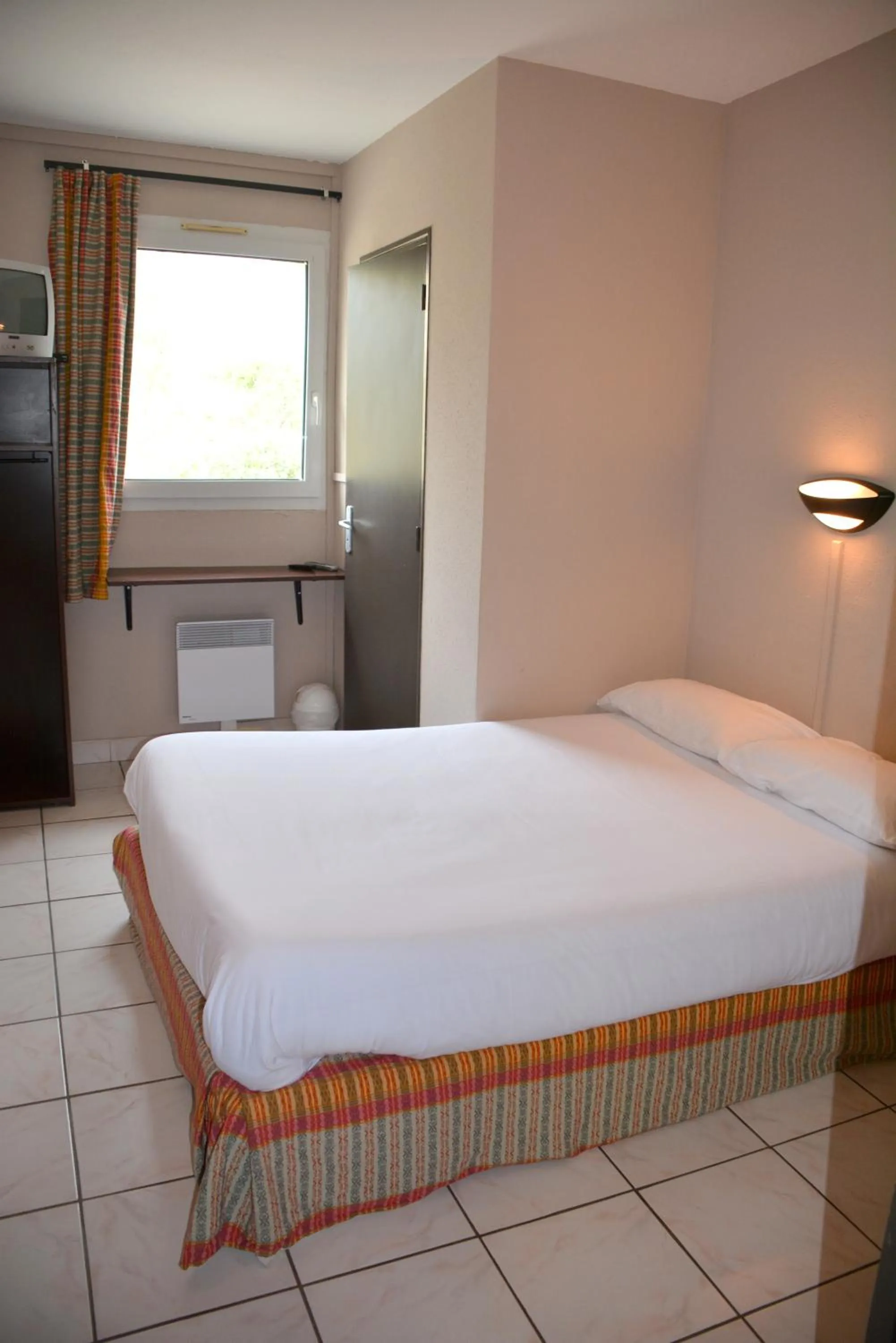 Bedroom in Hôtel Le Floreal