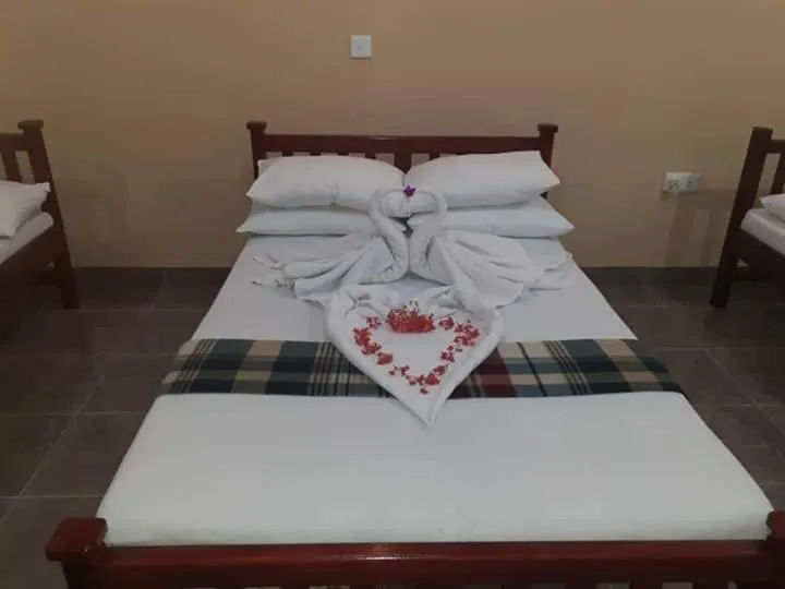 Bed in Anura Guest Inn