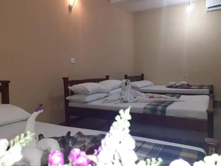 Bed in Anura Guest Inn