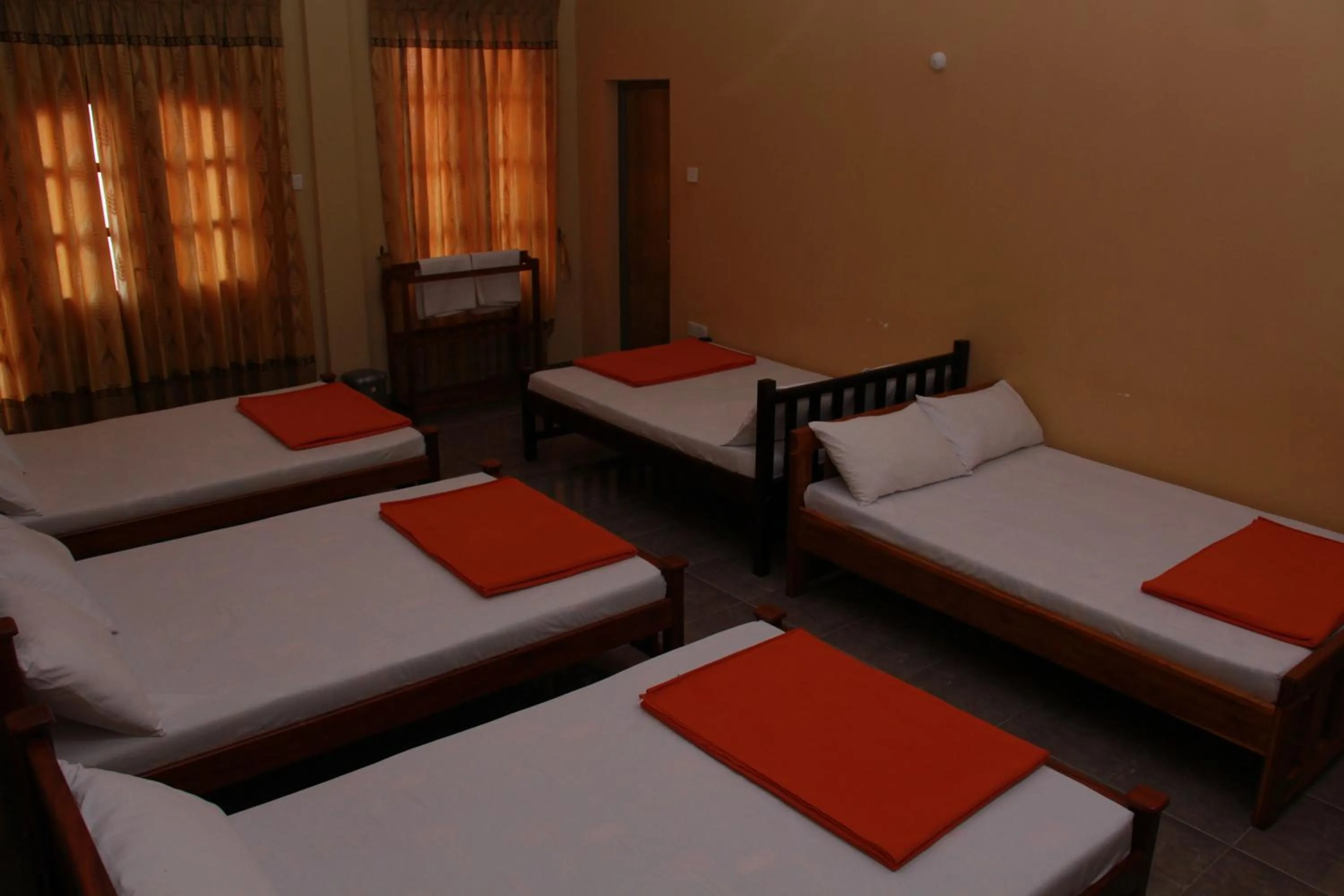 Bed in Anura Guest Inn