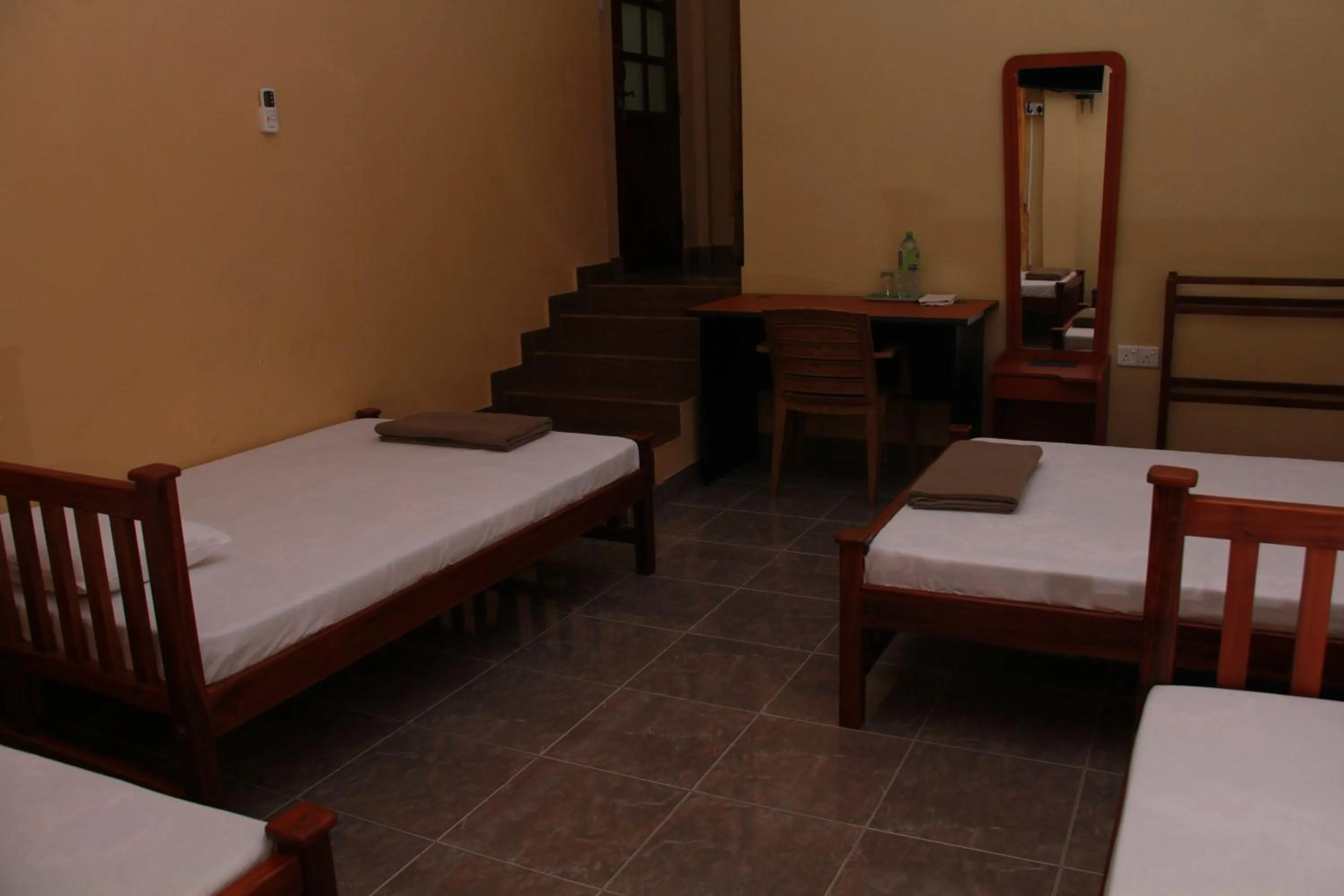 Bed in Anura Guest Inn