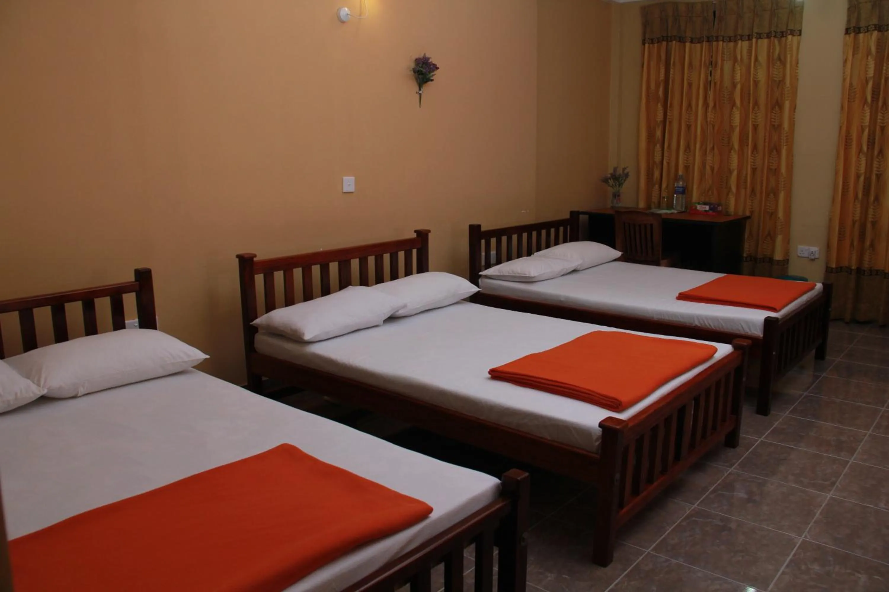 Bed in Anura Guest Inn