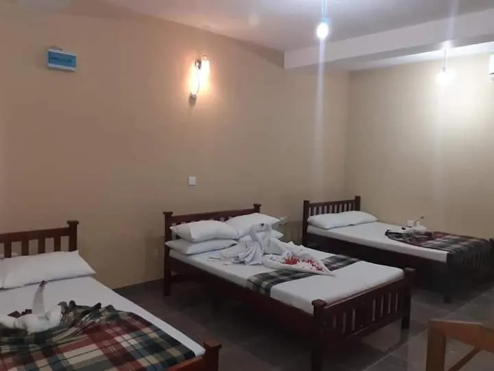 Bed in Anura Guest Inn
