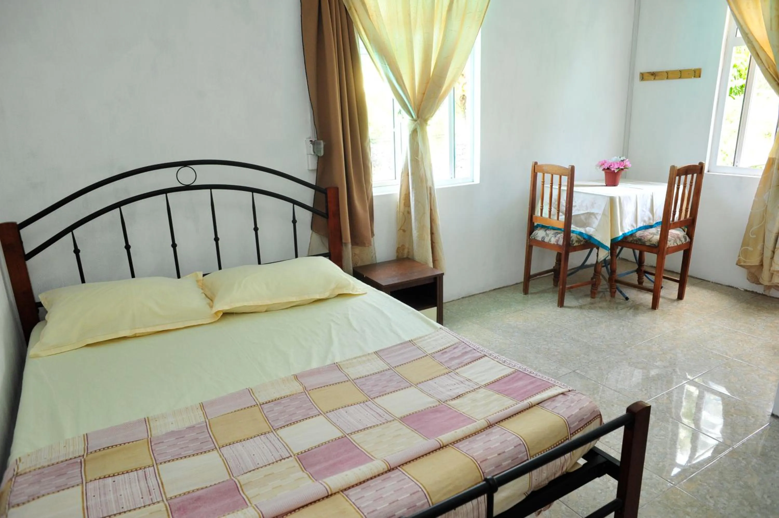 Bed in Chez Ronald Guest House